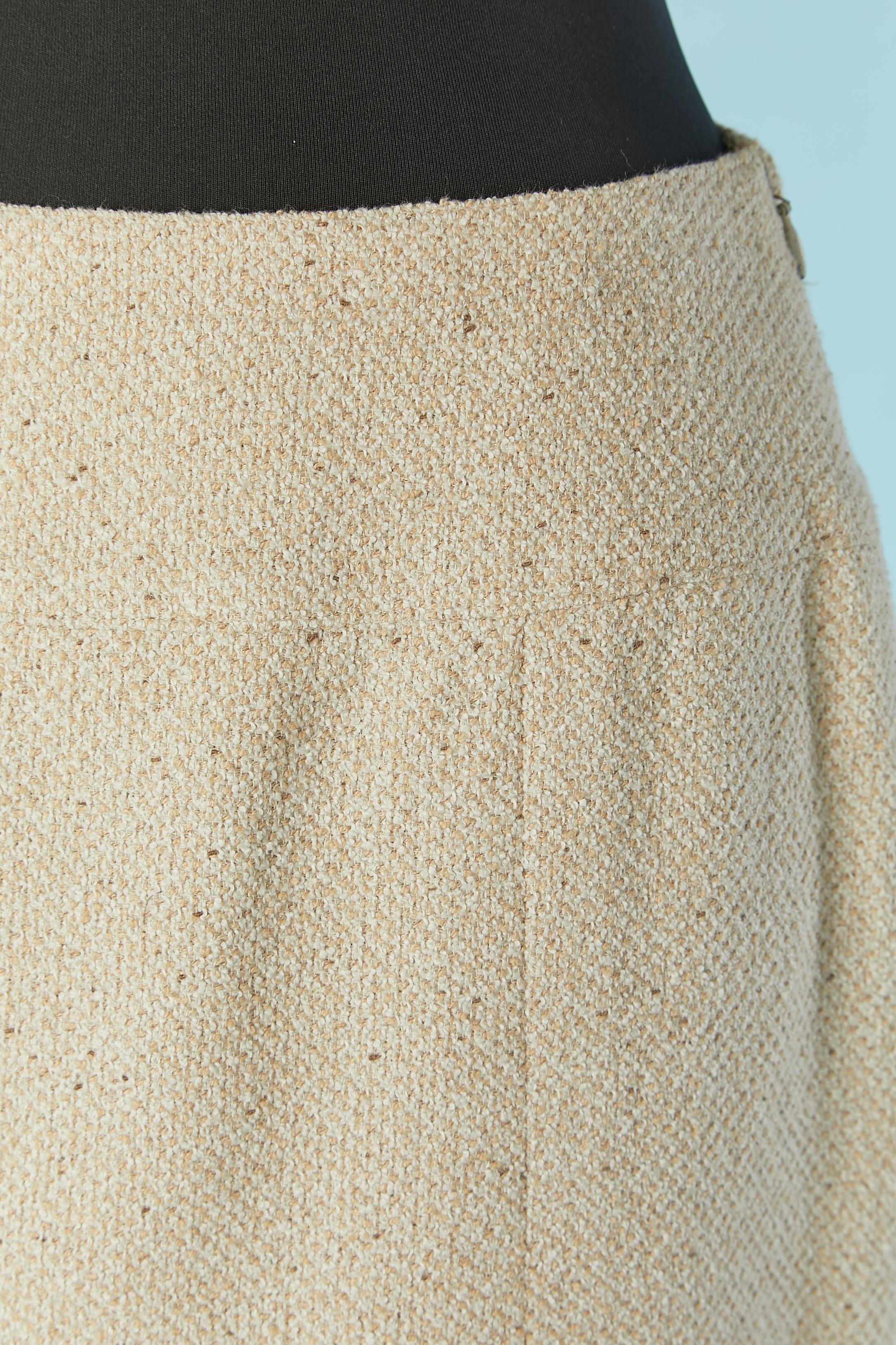 Beige tweed straight skirt . Main fabric composition: 48% cotton, 37% wool, 15% nylon. Silk branded lining. 
Zip and hook&eye closure on the left side. 
SIZE 38 (Fr) M 