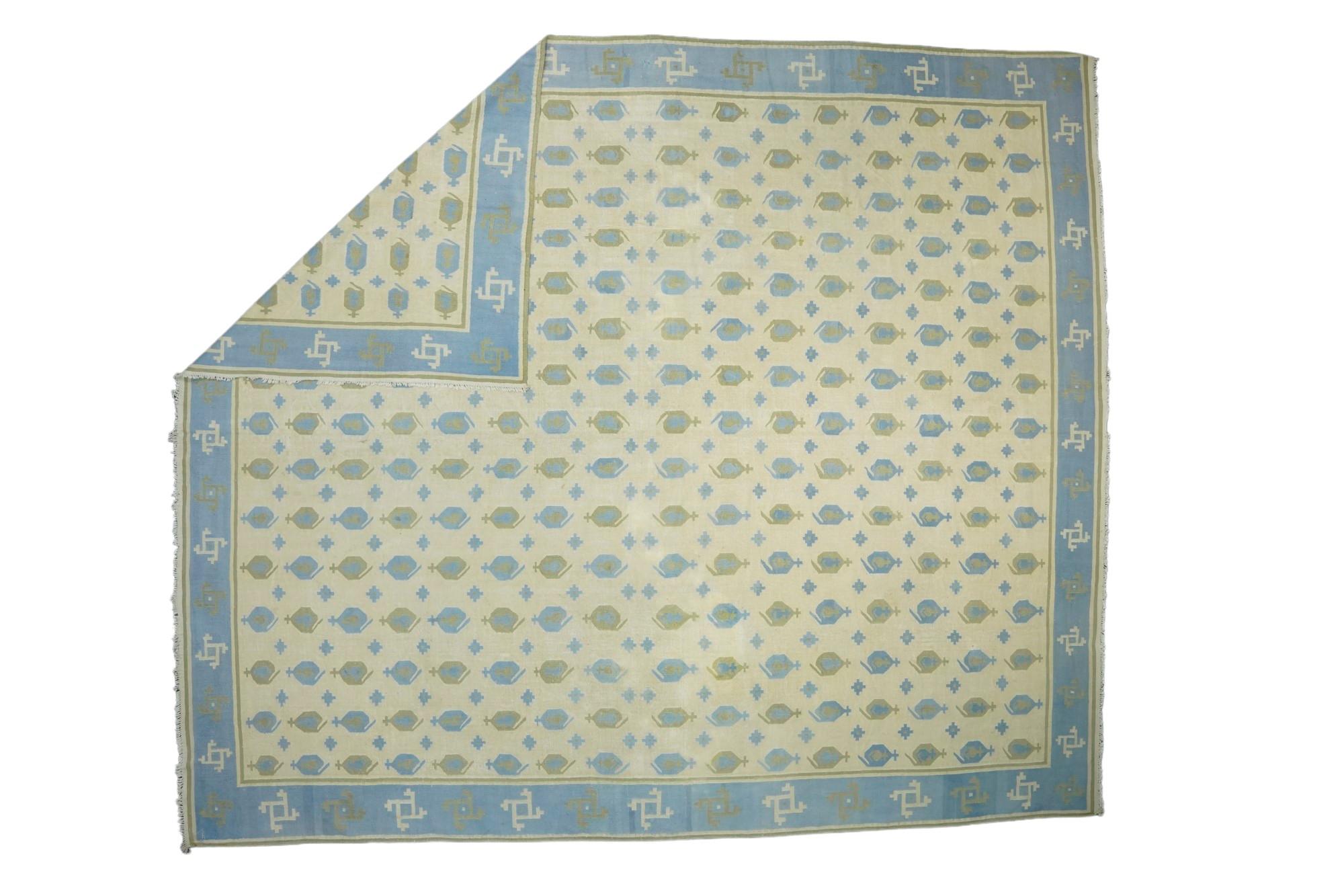 This 13x15 rug is a rare vintage Dhurrie rug from an exciting new mid-century curation by Rug & Kilim. Handwoven in a wool flatweave, it originates from India circa 1950-1960, and enjoys geometric patterns in sky blue and chartreuse green. 

On the