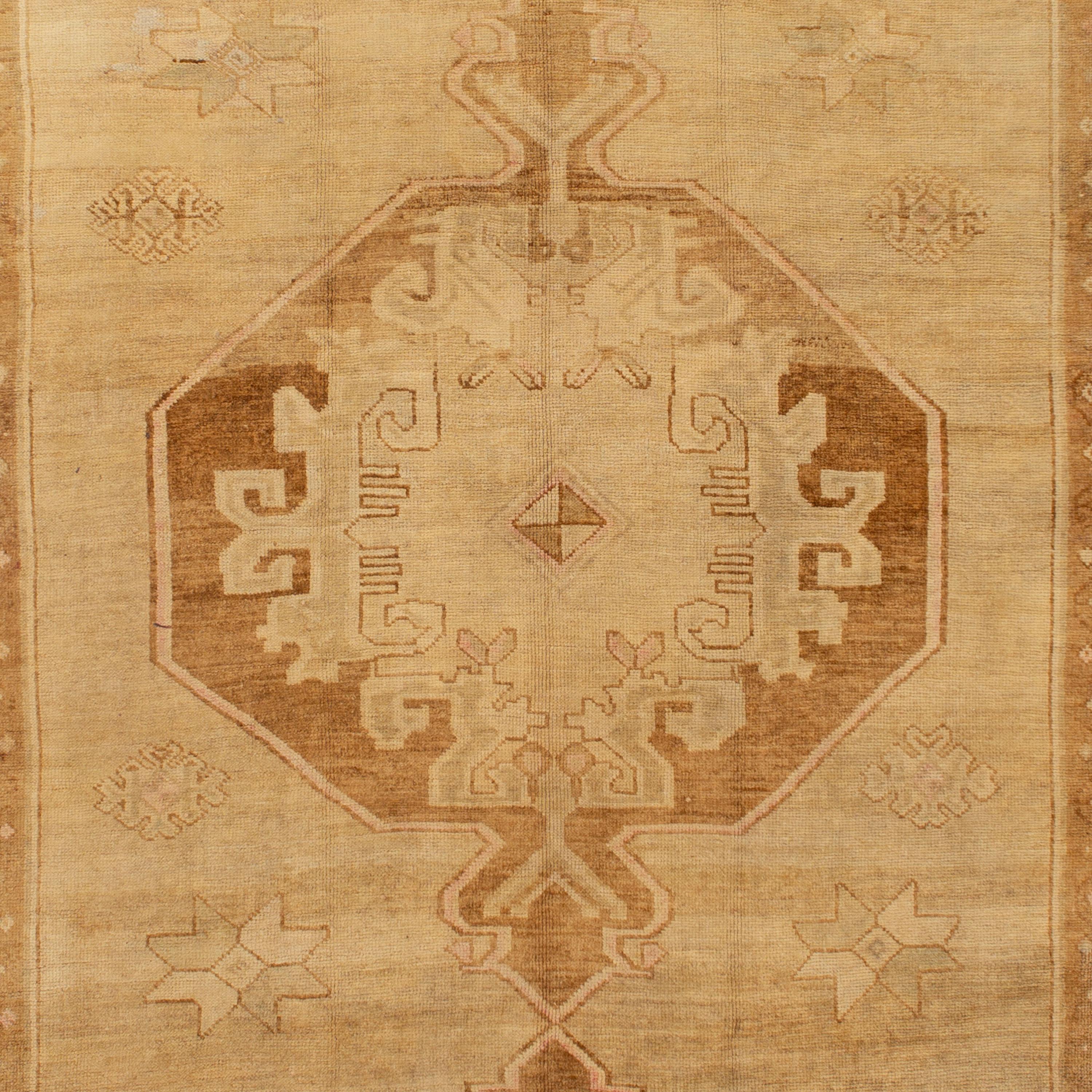 This vintage Turkish rug, circa the 1950s, was reduced to a low-contrast field through cycles of sun-fading and washing - achieving a natural undyed palette and venting the true form of the Kars rug by marrying artisan technique and the natural