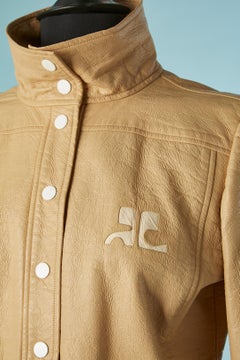 Beige vinyl single-breasted jacket with white snap COURREGES Circa 1970
