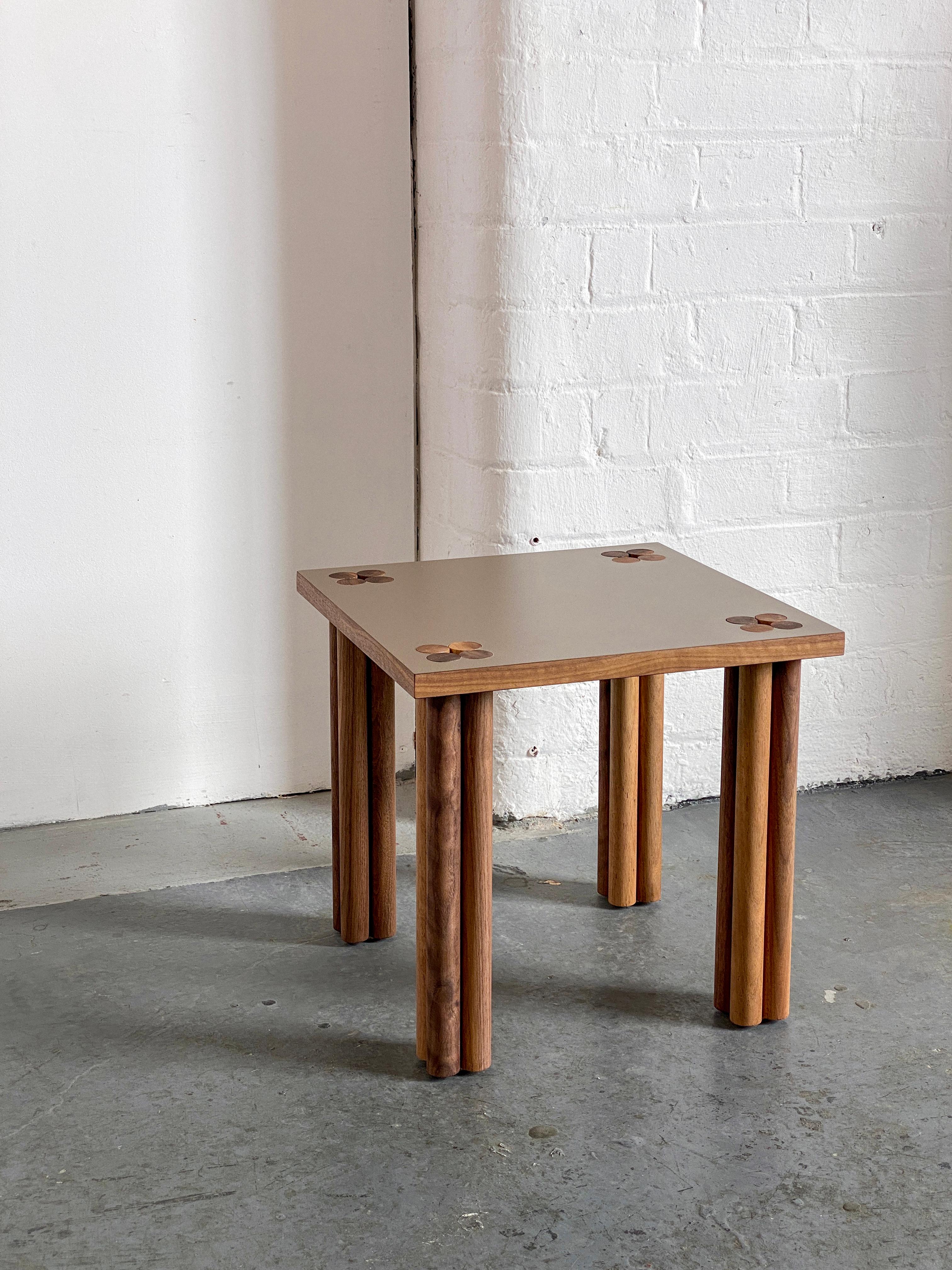 Beige & walnut Hana side table.
Dimensions: D 35 x W 35 x H 33 cm.
Materials: solid walnut wood, walnut veneer, Formica
Oak or other wood possible. 

Hana is Japanese and means flower - it is a collection of side tables and a sideboard. The