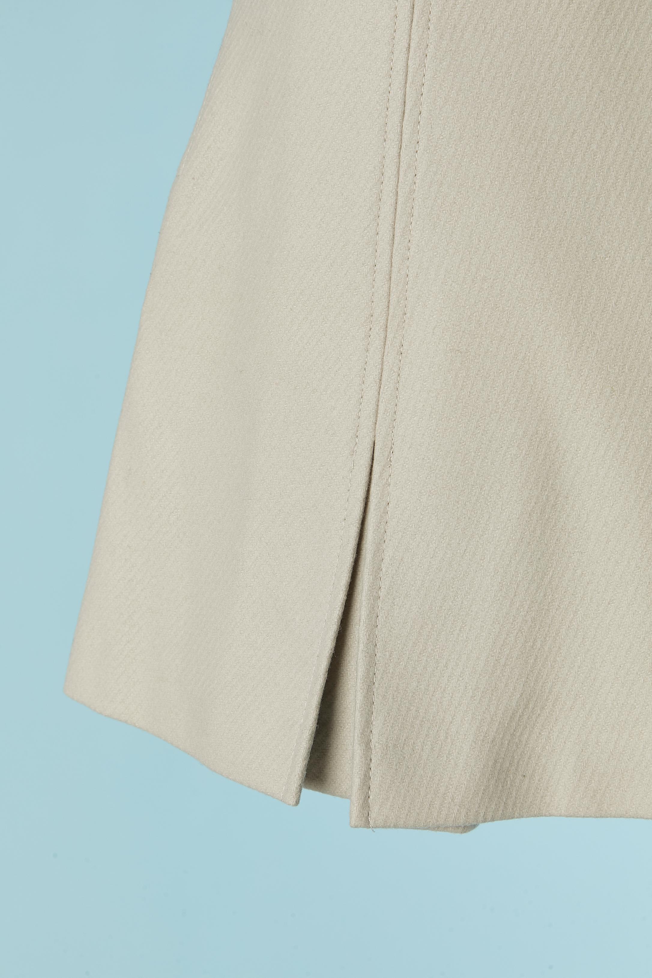 Beige wool mini skirt with box-pleats. Main fabric composition: 75% wool, 20% polyamide, 5% cashmere.
Lining composition: 52% polyester, 48% rayon. 
Invisible zip closure on the back side.
New with tag and authenticity certificate.
SIZE 40 (It) 4