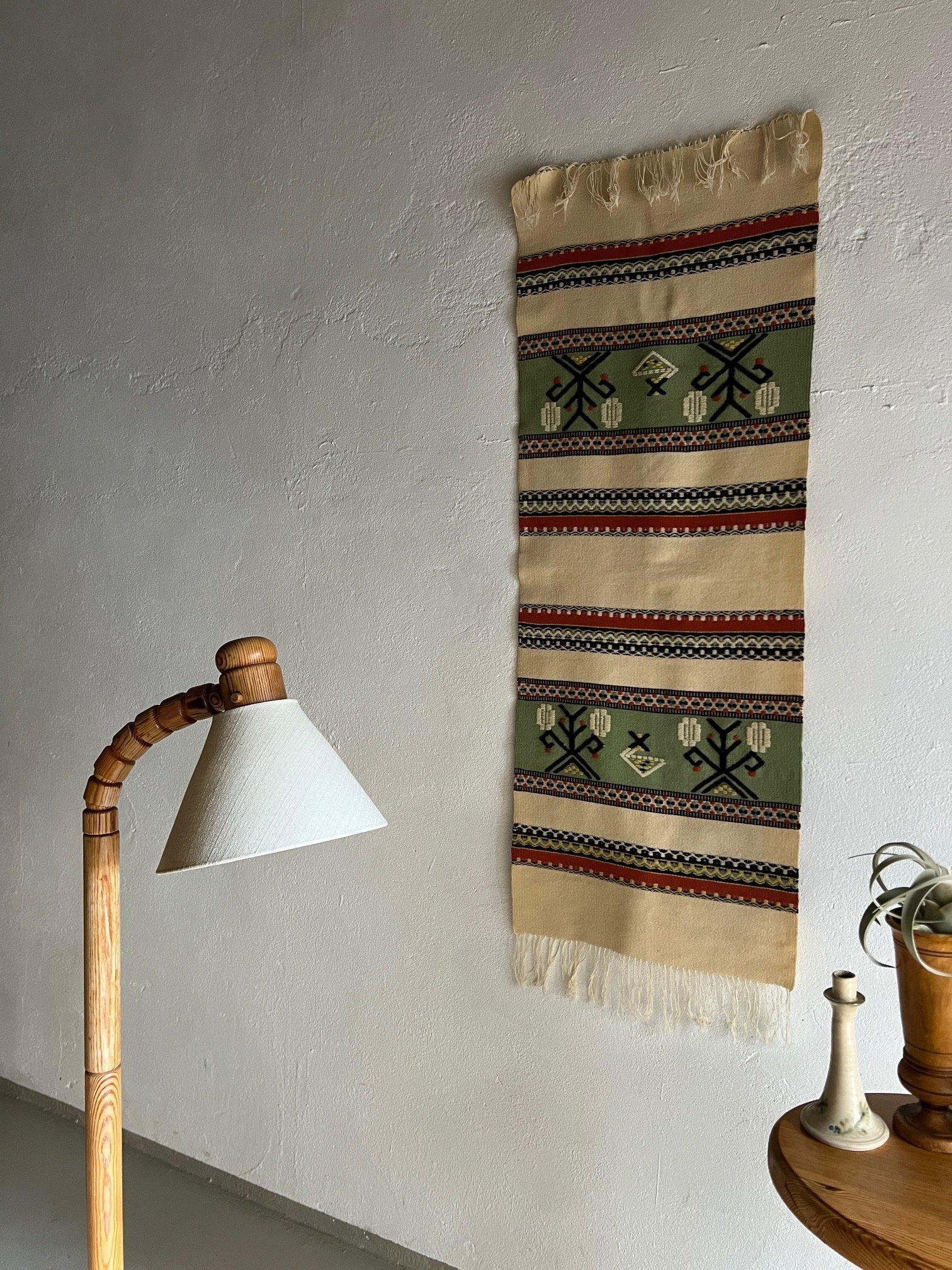 Vintage wool blanket or runner which may be used as a wall decor.

Additional information:
Origin: Sweden
Design period: 1960s
Dimensions: 50 D x 132 W cm
Condition: Good vintage condition