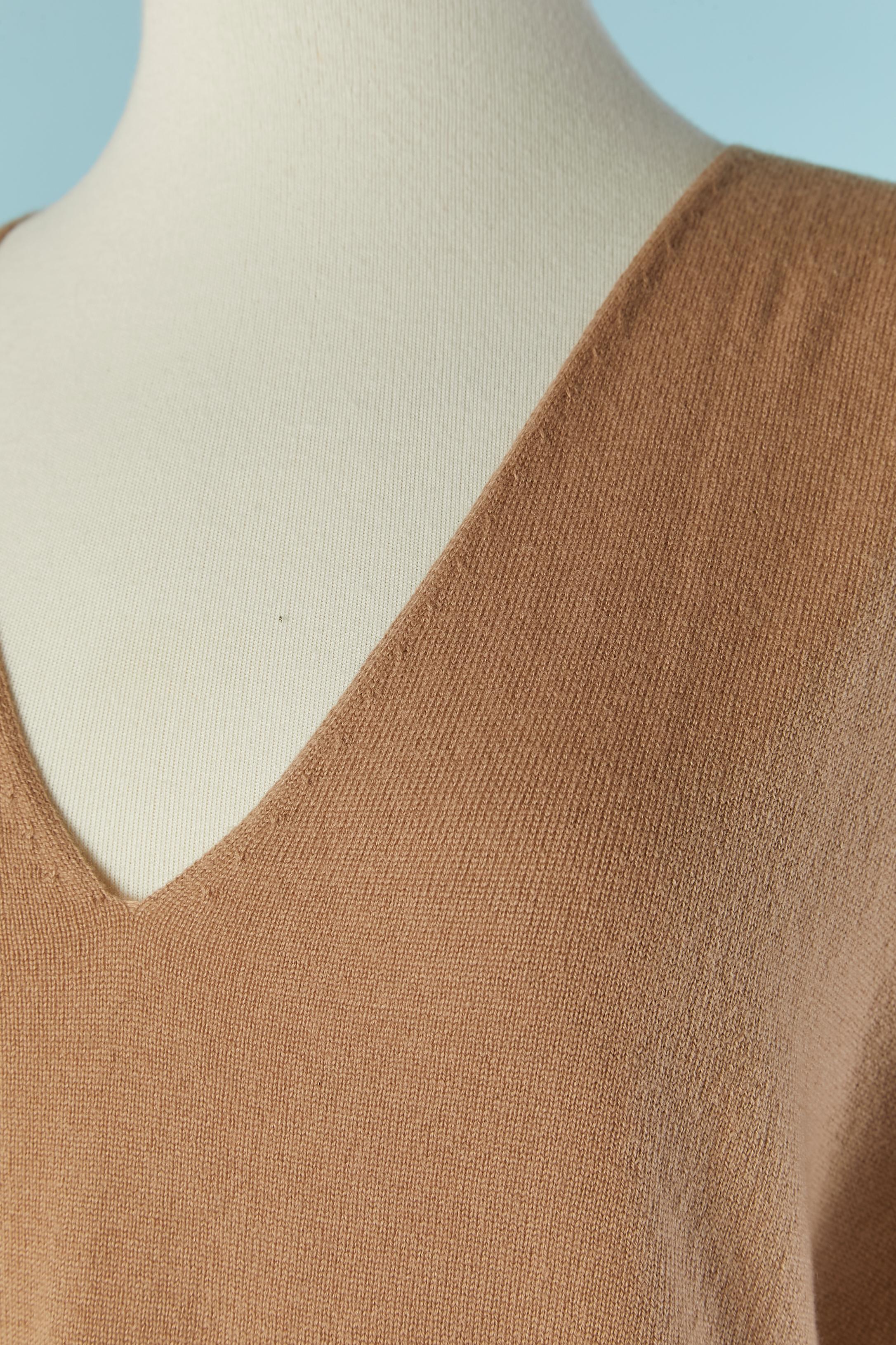 Beige wool sweater with V neckline. 
NEW with tag.
SIZE S on tag but fit also M 