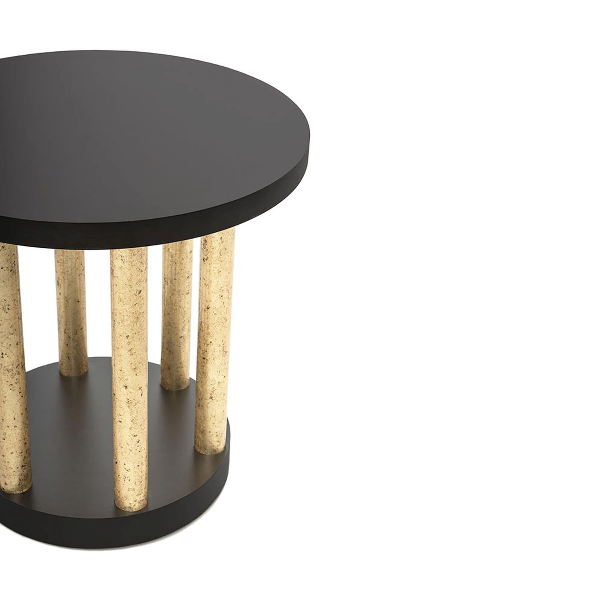 A bold and beautiful accent piece, the Bel Air Accent Table II is a flawlessly handcrafted work of art. A set of cylindrical pillar legs arranged in a circle support a sleek, round top and base. The high quality is apparent in craftsmanship and