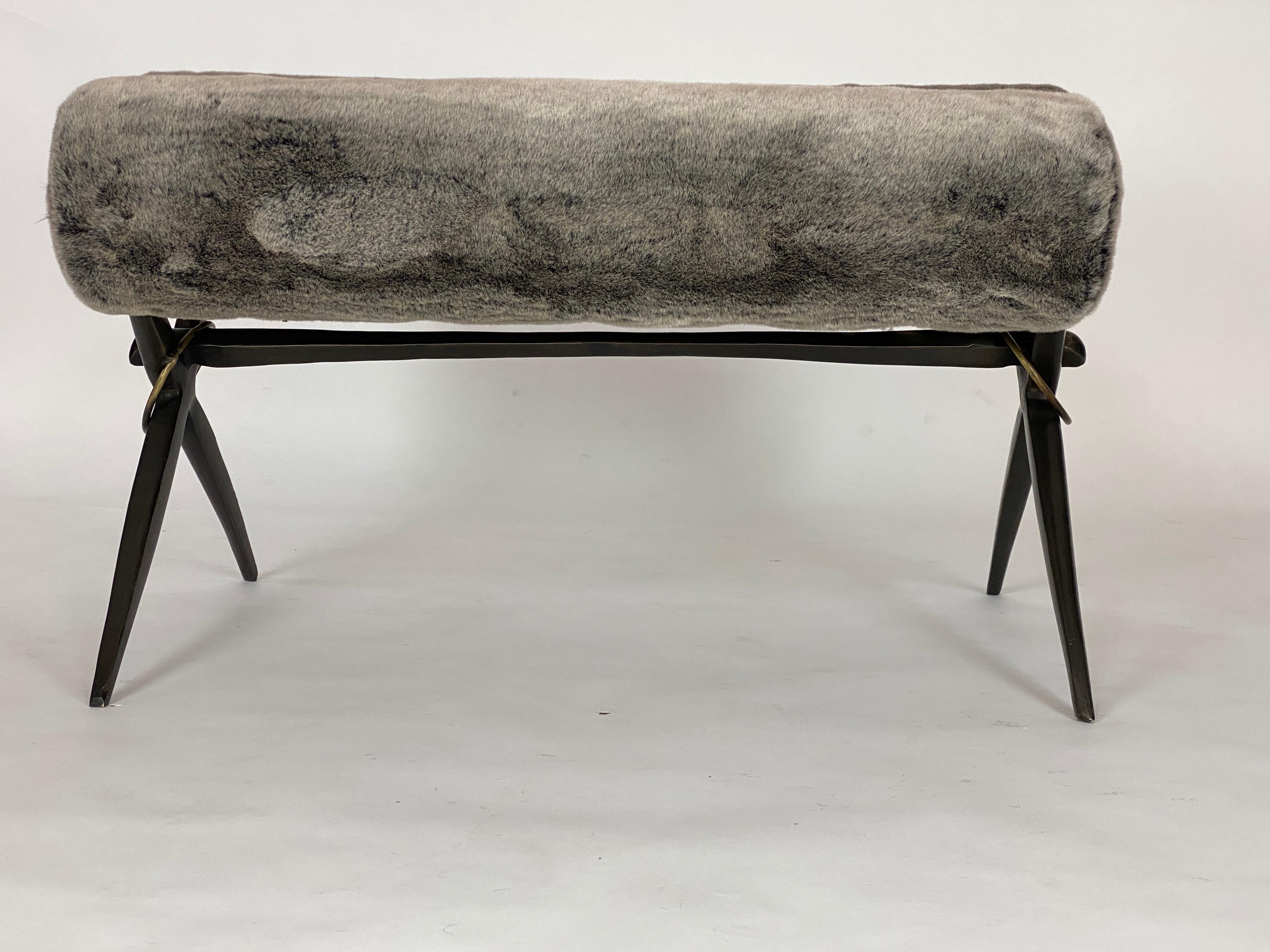 Elegance at its finest. This bench will add a perfect finishing touch to your homes
sophistication, it will certainly be a focal point in the room. This bench with it cast
bronze X base and brass accents has a tubular cushion. This model has