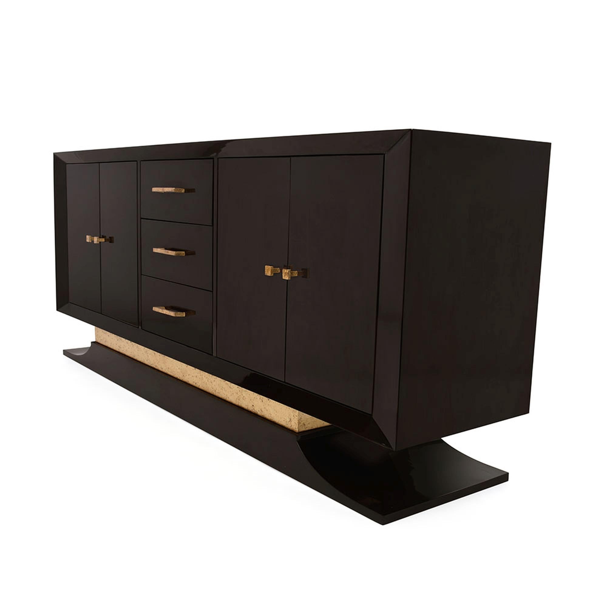 Exuding sophistication, and with a nod to old Hollywood glamour, The Bel Air credenza is a spectacular statement piece. Composed of a wood body and pedestal stand, this piece is supported by a raised metal base that has been hand-gilded and leafed