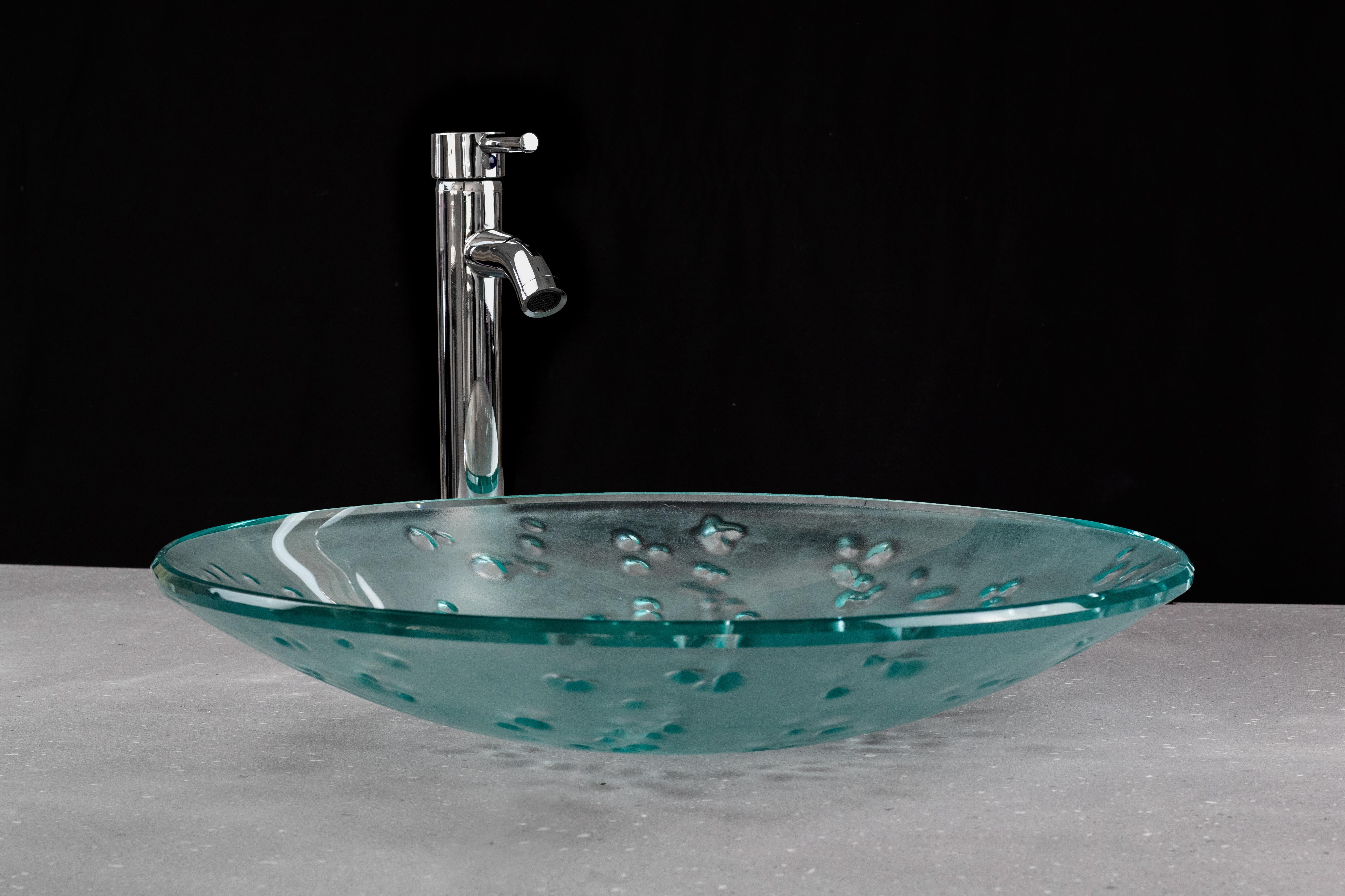 Bel Ava Washbasin by Studio Nosqua
Dimensions: D 52 x W 52 x H 93 cm
Material: Glass.
Basin drain not included. 

Between desertic expanses and frozen mountains, Bela Ava offers you to travel towards fascinating landscapes.
This sink uses the same