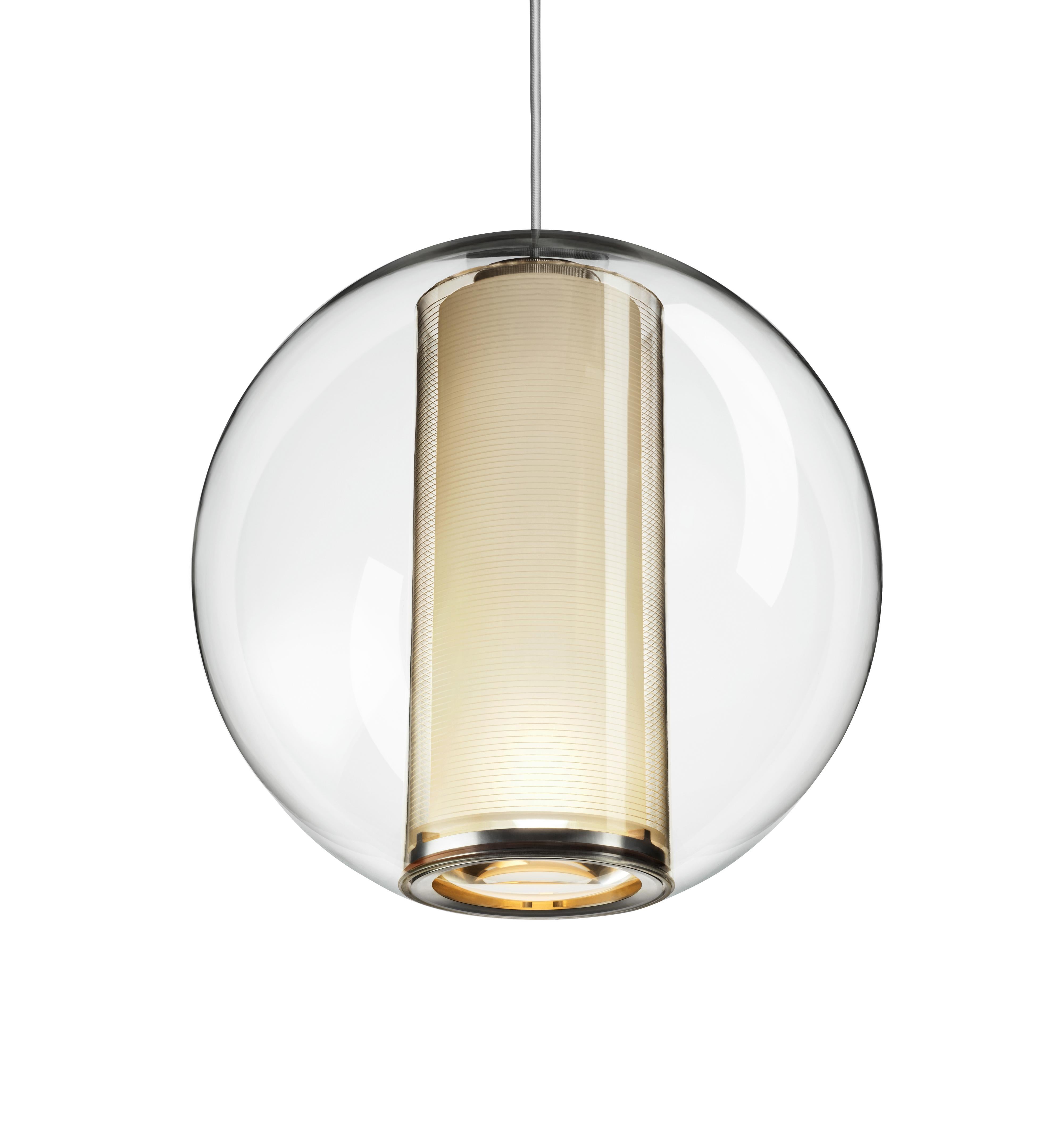 Bel Occhio pendant is a study in weightlessness and transparency. Its inner column suspends freely within a clear acrylic shell and provides both ambient and focused illumination. Available with orange or white diffuser.

Features:
Full range