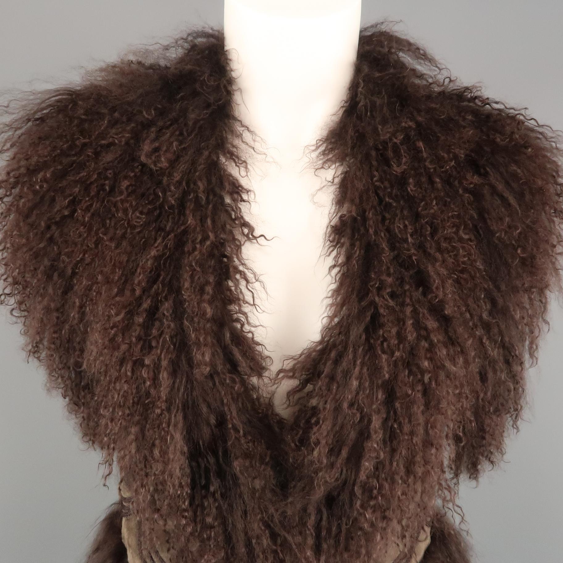 BELA vest comes in olive green suede with embroidery and full brown Mongolian curly lamb fur liner collar, and trim.
 
Very Good Pre-Owned Condition.
Marked: XS
 
Measurements:
 
Shoulder: 13 in.
Bust: 34 in.
Length: 23 in.