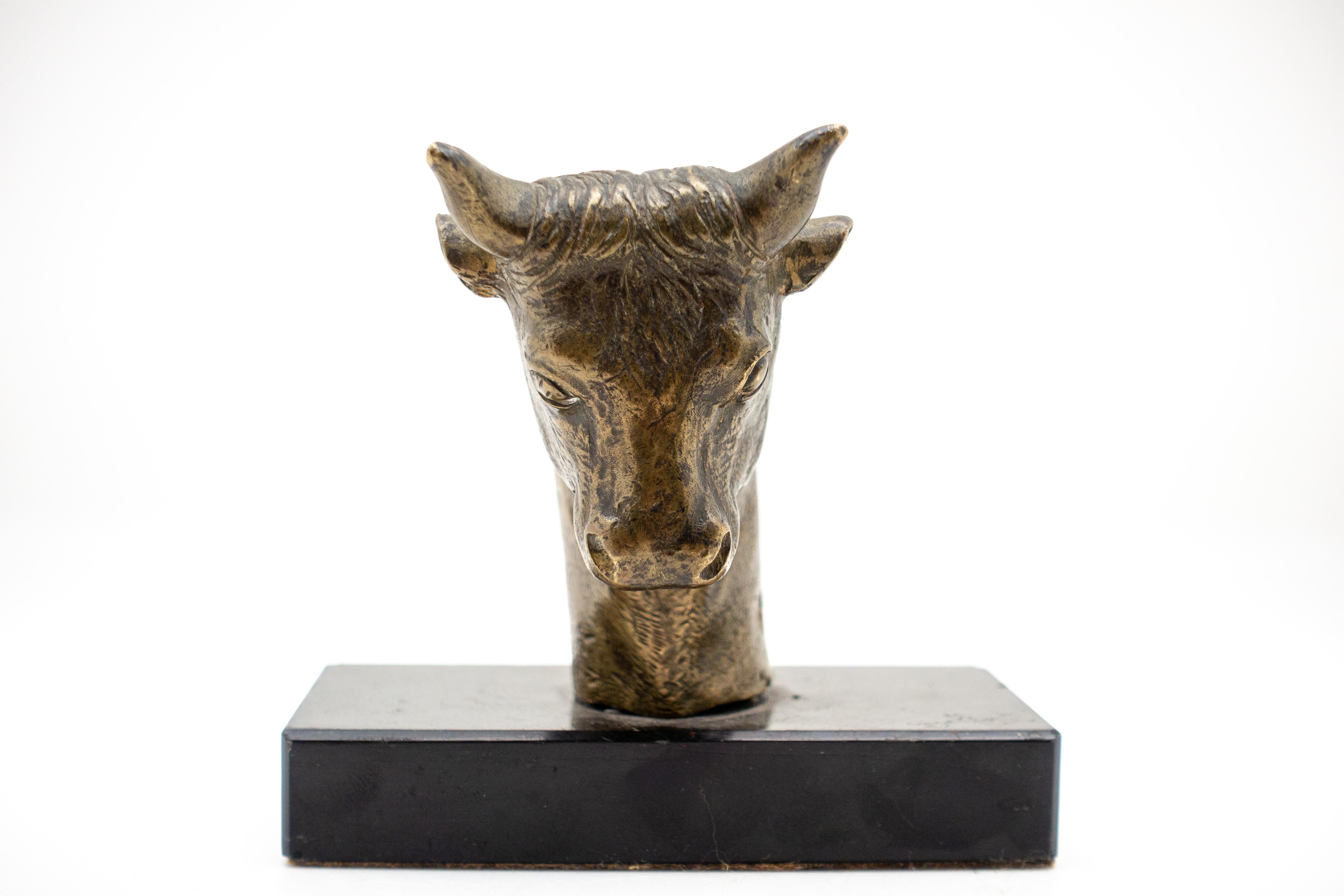 Small bronze sculpture of Belfort bull head on black marble base. Likely the handle of a cane. Great gift for any Wall Street broker!!