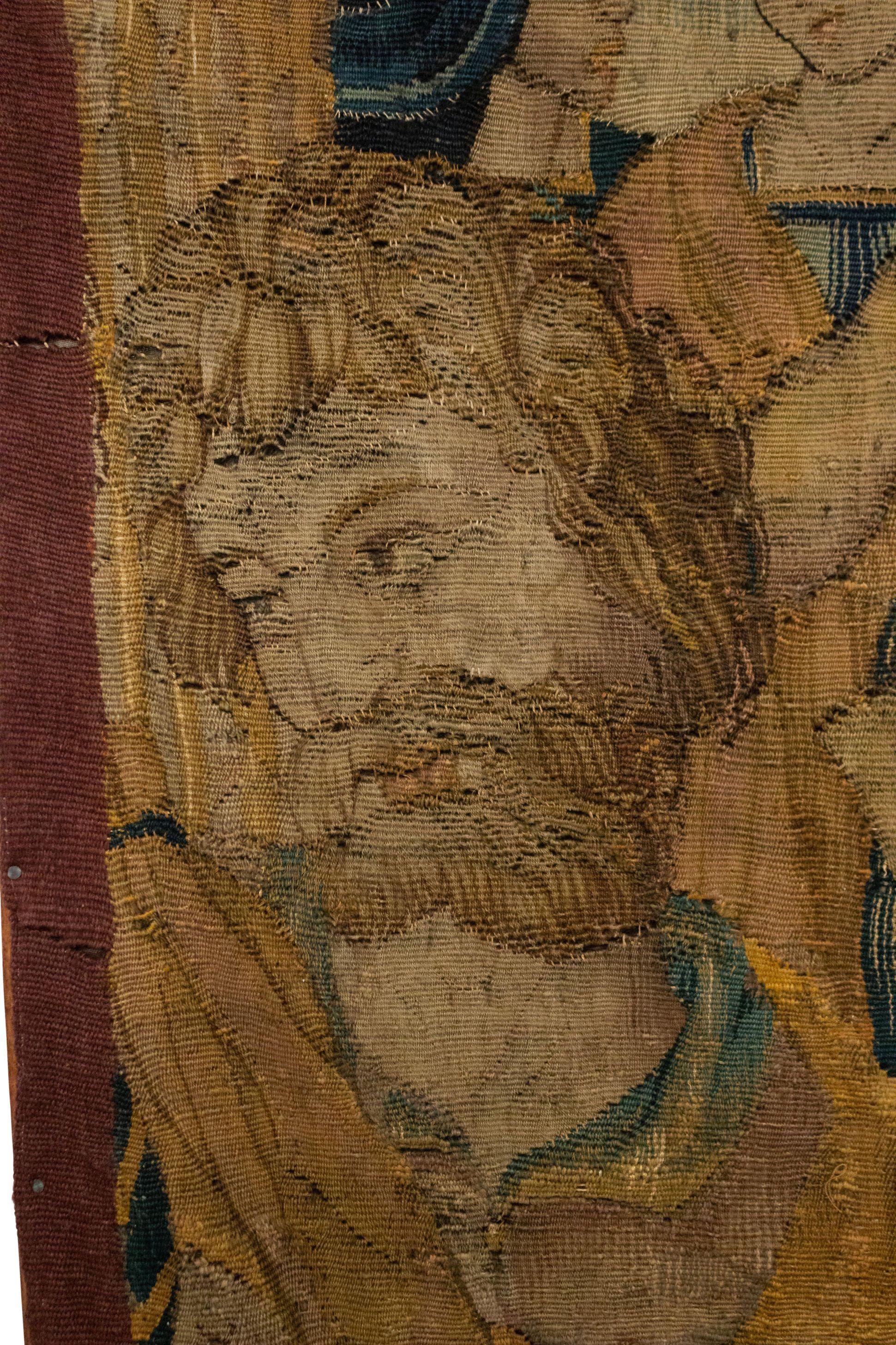 Belgian (17/18th Century) vertical woven tapestry of kneeling king with figures affixed to a wooden frame.
 