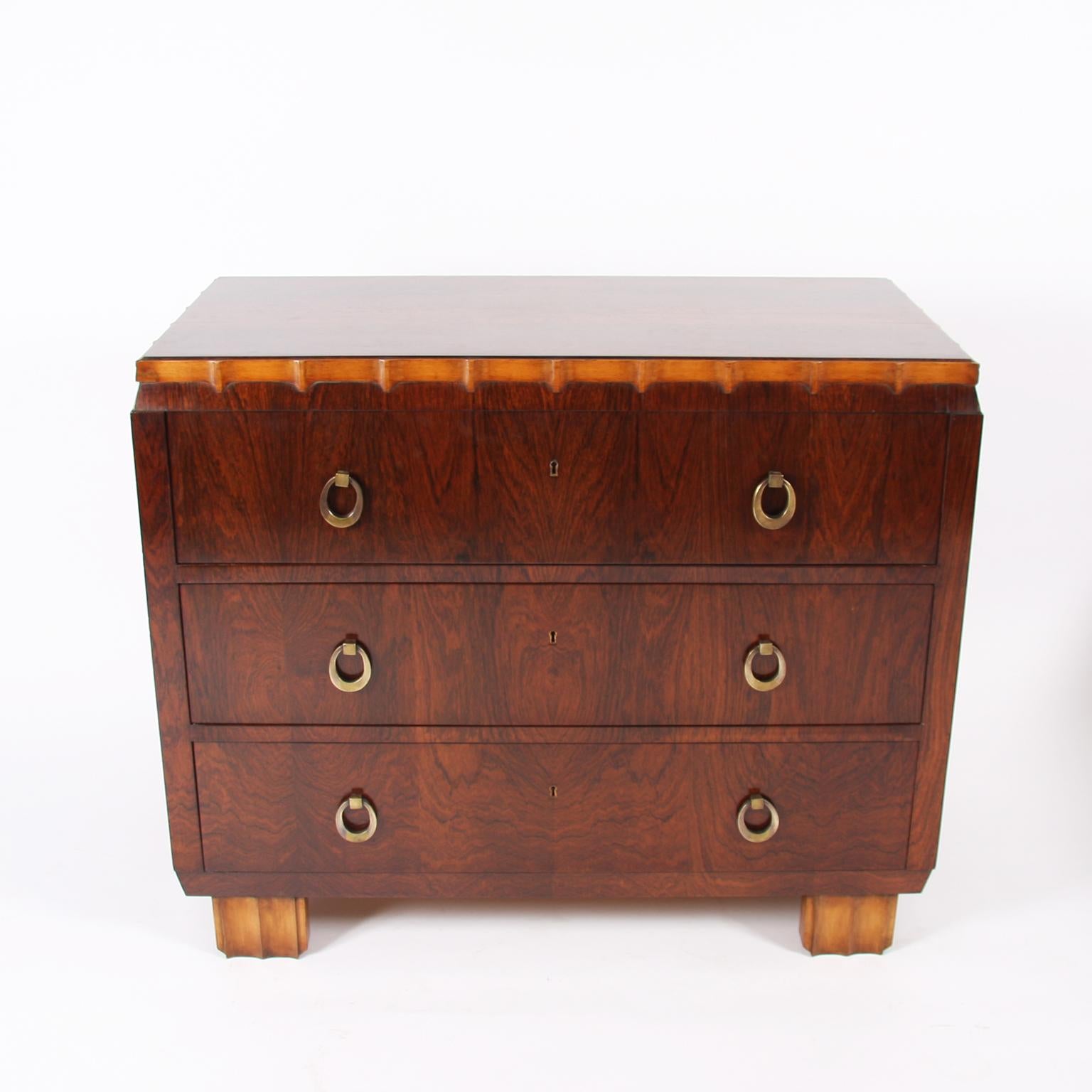 Belgian, circa 1920.

A unique hardwood chest of drawers, with beautiful brass handles. Golden detail to the top and feet.

In excellent condition.