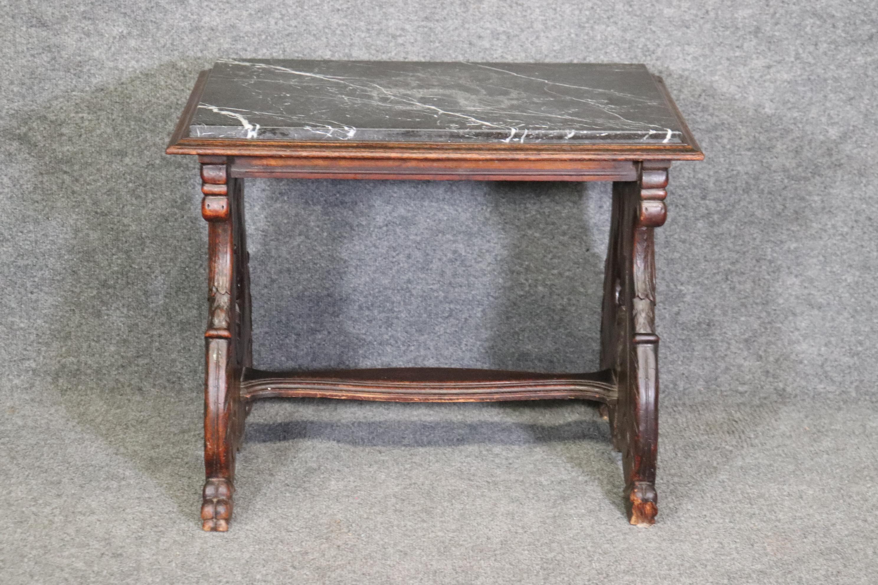 Dimensions- H: 20in W: 25 1/4in D: 17 1/2in 

This Belgian antique 19th Century marble top accent table is made of the highest quality!  If you look at the photos provided, you can see the detail in the griffins or birds on each end of the table as