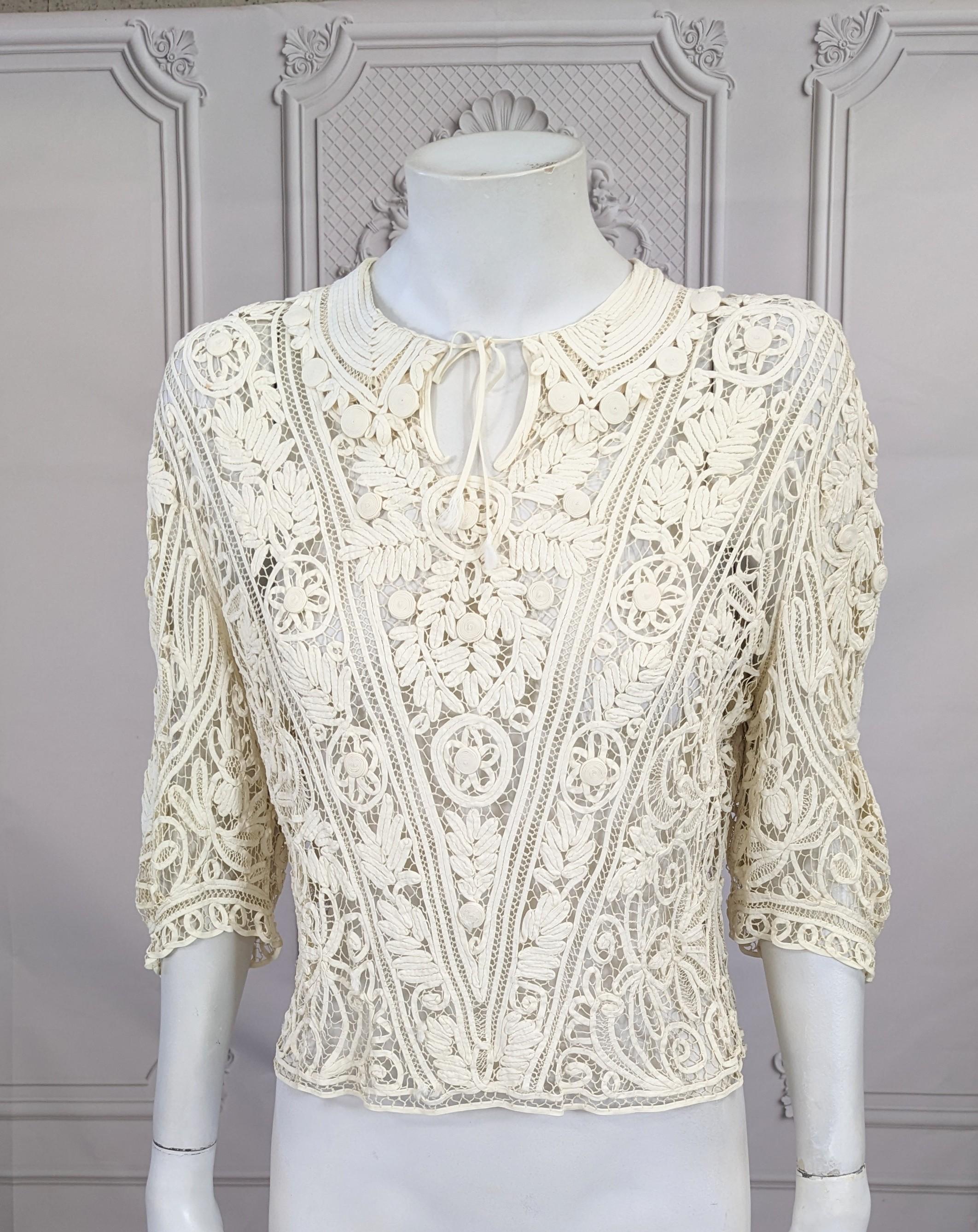 Belgian Art Deco Bias Tape Lace Blouse from the 1930's composed of many yards of bias tape manipulated and hand stitched into floral patterns and leaf forms. Completely hand made with threaded 
