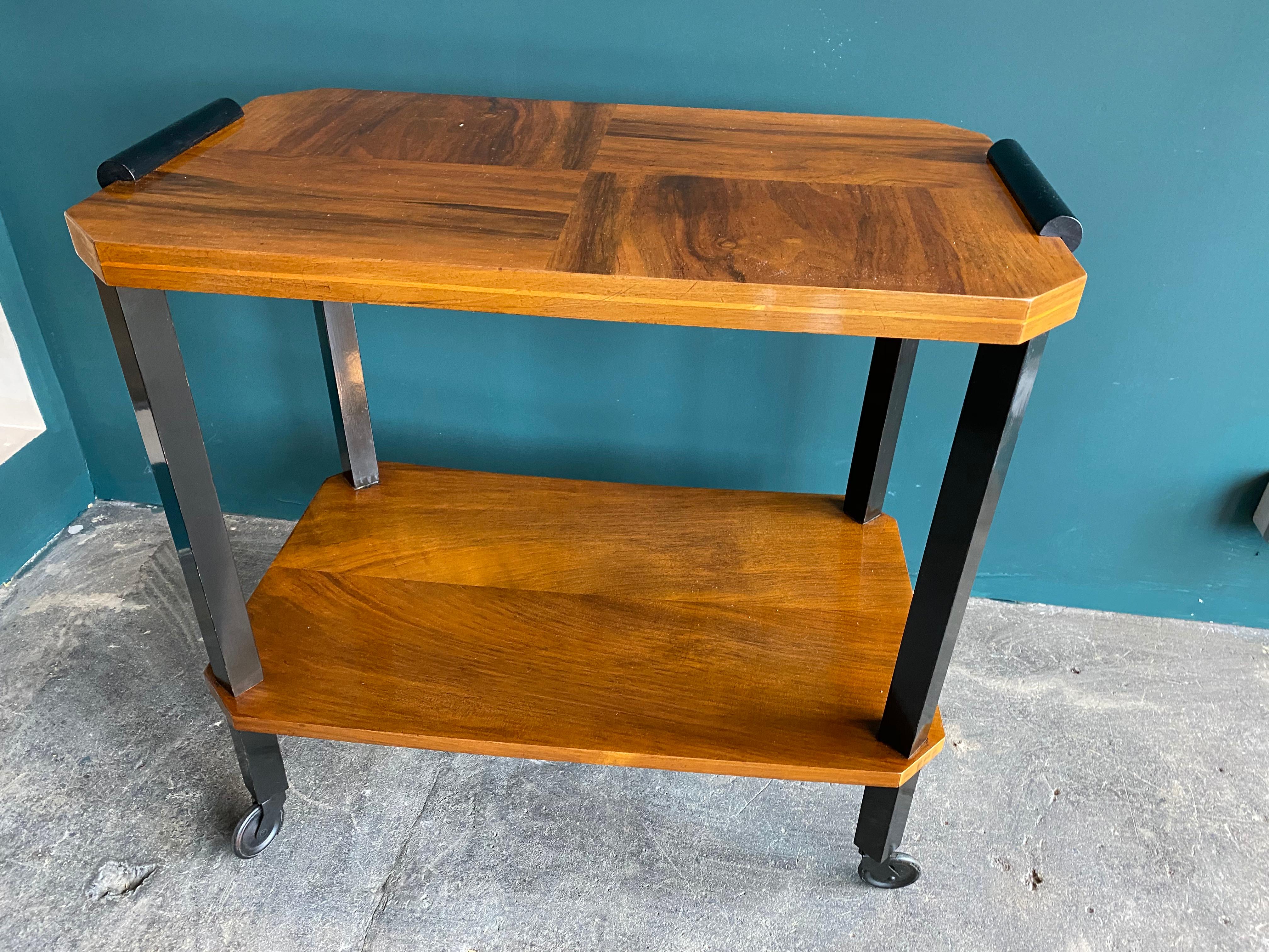 Belgian Art Deco serving trolley, bar trolley 1920s, wood inlay veneer pattern. Agile little bar wagon from the 1920s. The shelves are veneered, the 4 legs on castors painted black. The serving trolley has been restored and is a typical Art Deco