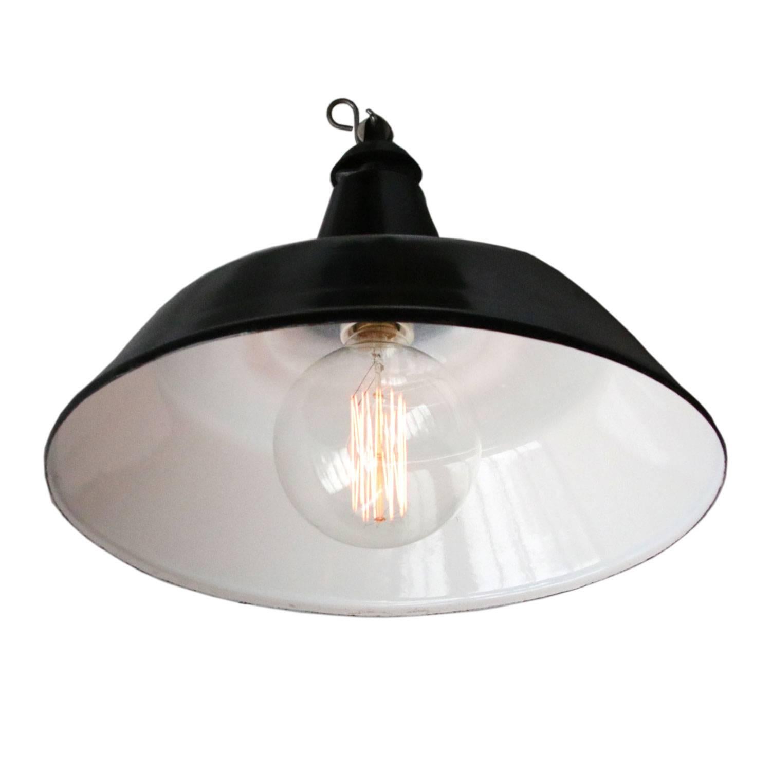 Belgian industrial hanging lamp. Black enamel white interior.

Weight: 1.5 kg / 3.3 lb

Priced per individual item. All lamps have been made suitable by international standards for incandescent light bulbs, energy-efficient and LED bulbs.
