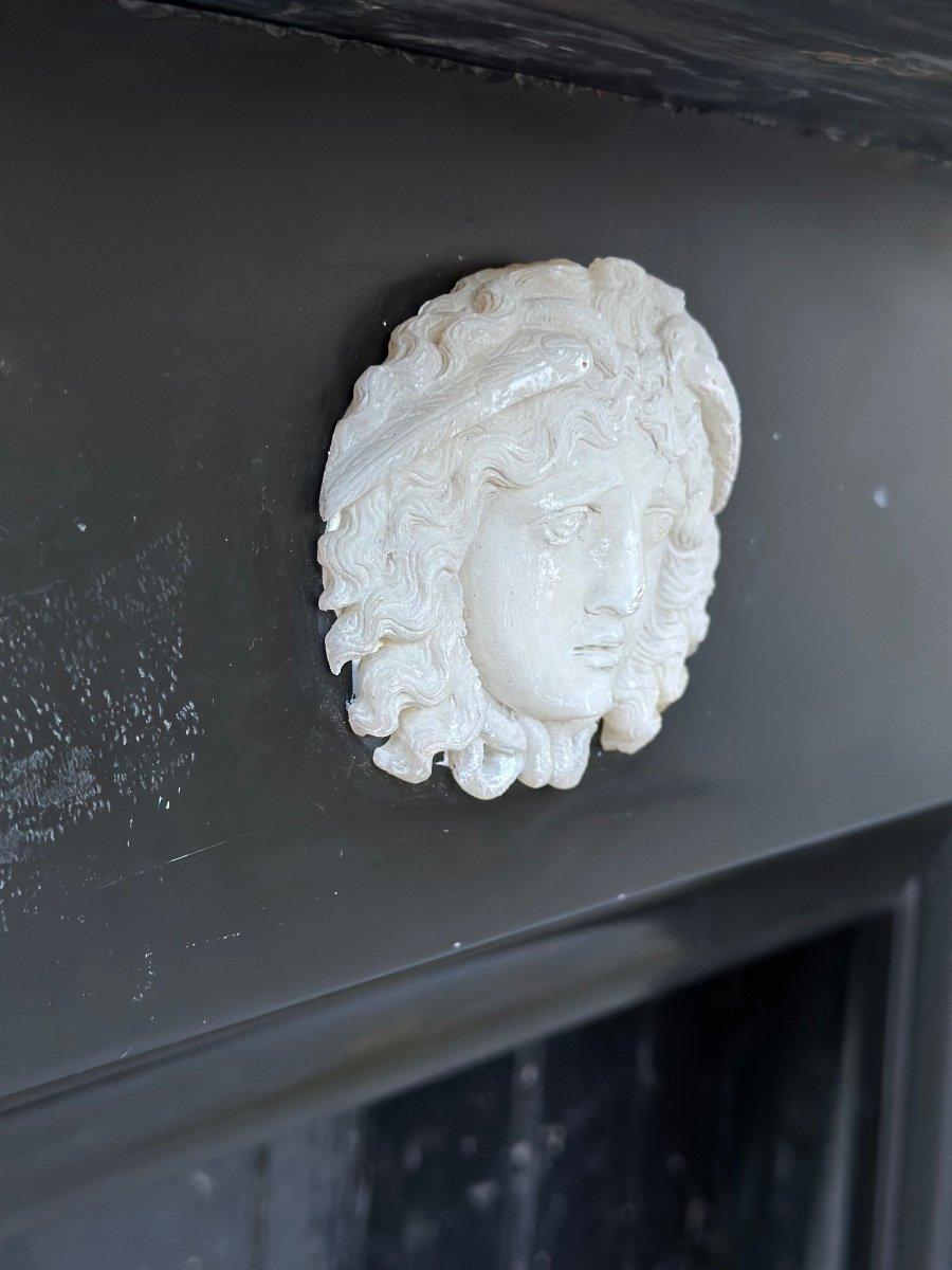 Fireplace In Black Belgian Marble And Mascarons In Statuary White, lion claw feet on consoles. small chip on the tablet and consoles. dimensions of the fireplace 86x72cm