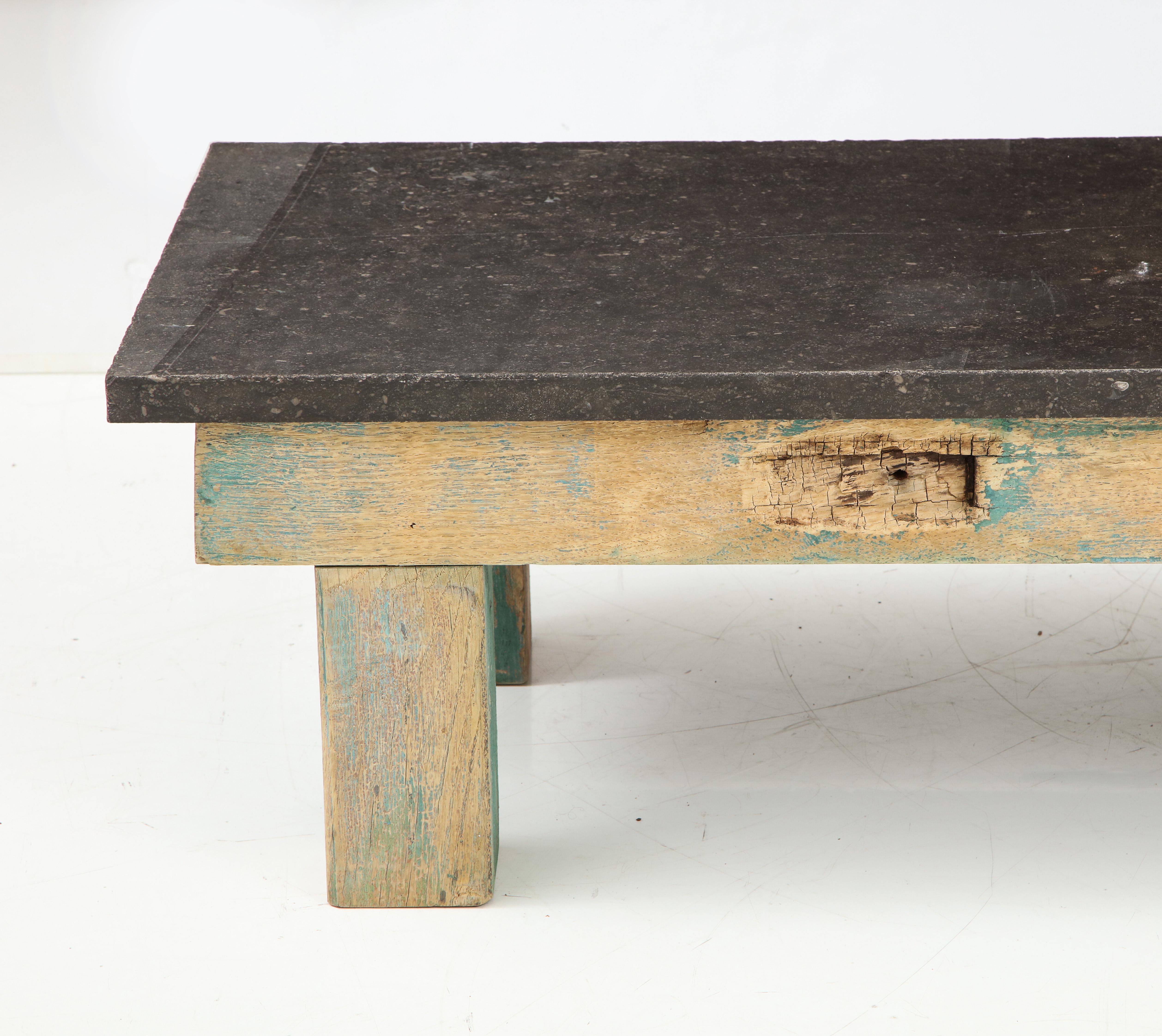 Belgian bluestone and oak worktable base table
Primitive, Japanese Aesthetic
French, circa 1900

Fantastic very long coffee table or low console.