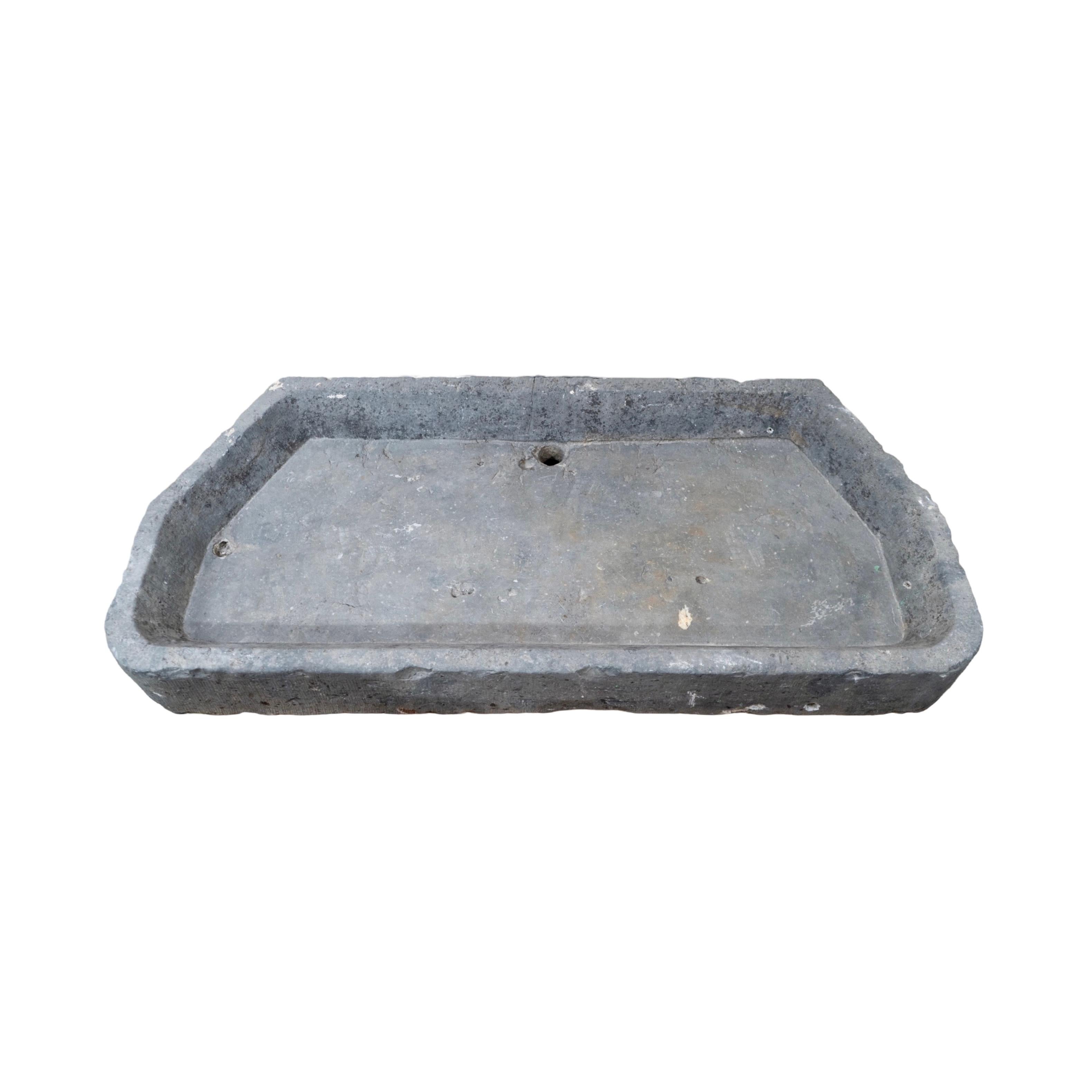 This 18th century Belgian Bluestone Sink is an elegant and timeless addition to any kitchen or bathroom. This beauty is wide in size and It's natural variations and subtle hues give it a unique character that is sure to stand out. Comes pre-drilled