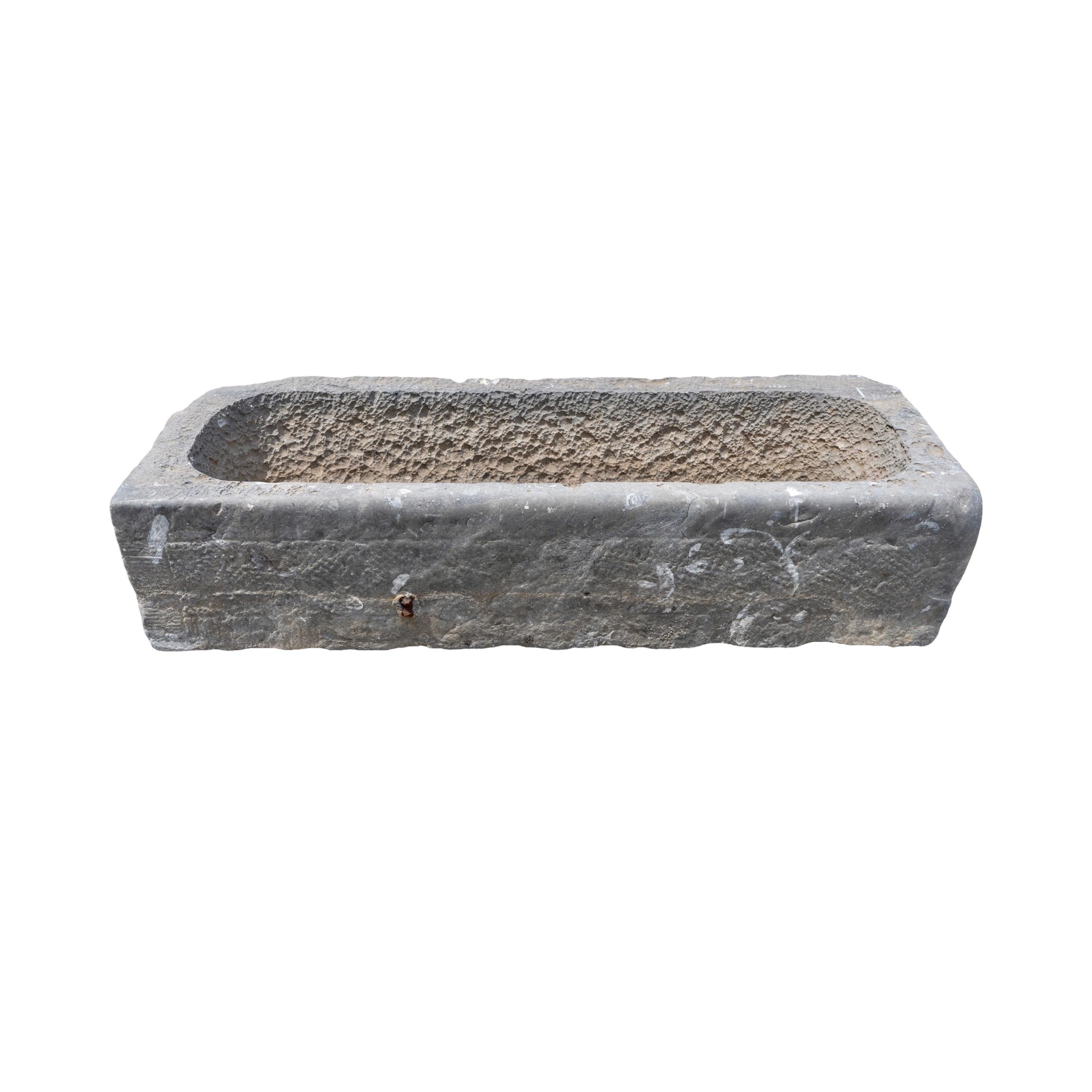 Expertly crafted in Belgium during the 18th century, this mid-size trough made of beautiful bluestone adds a touch of elegance to any garden or outdoor space. Its sturdy design and timeless appeal make it a perfect choice for any garden or landscape