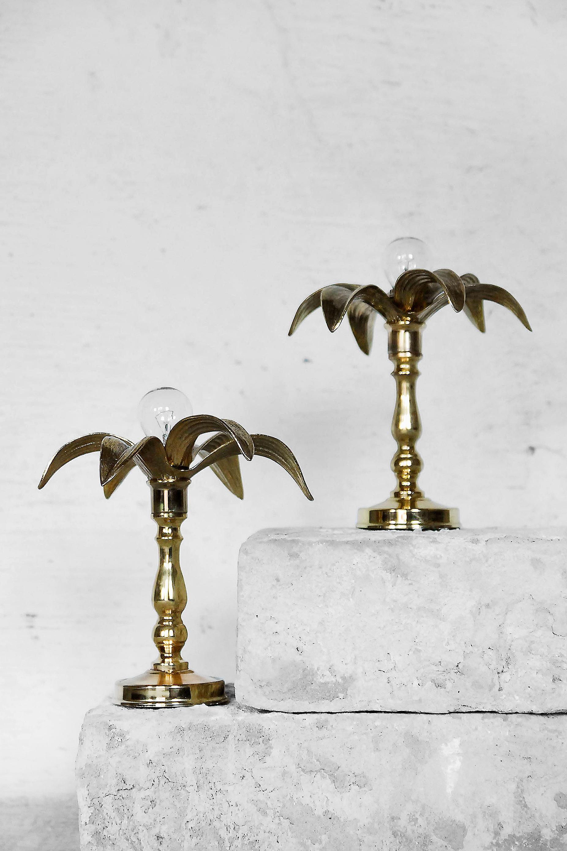 These table lamps were manufactured in Belgium by Massive during the 1970s. They were designed in a Hollywood Regency style and draw heavily on Willy Daro designs. These lights have the aesthetic of life-size flowers, sculpted in warm gold brass,