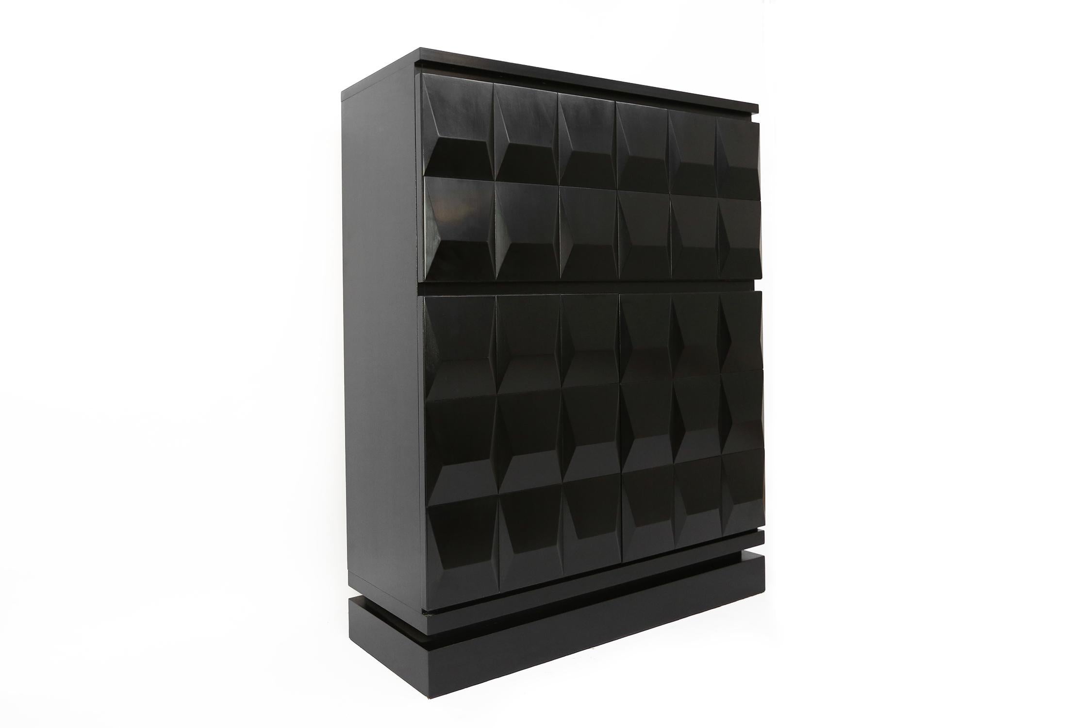 Beautifull graphical black Brutalist highboard made in the seventies in Belgium. This cabinet has a well crafted graphic pattern and was made in solid ebonized black lacquered mahogany. The high quality wood and symetric design and pattern add to