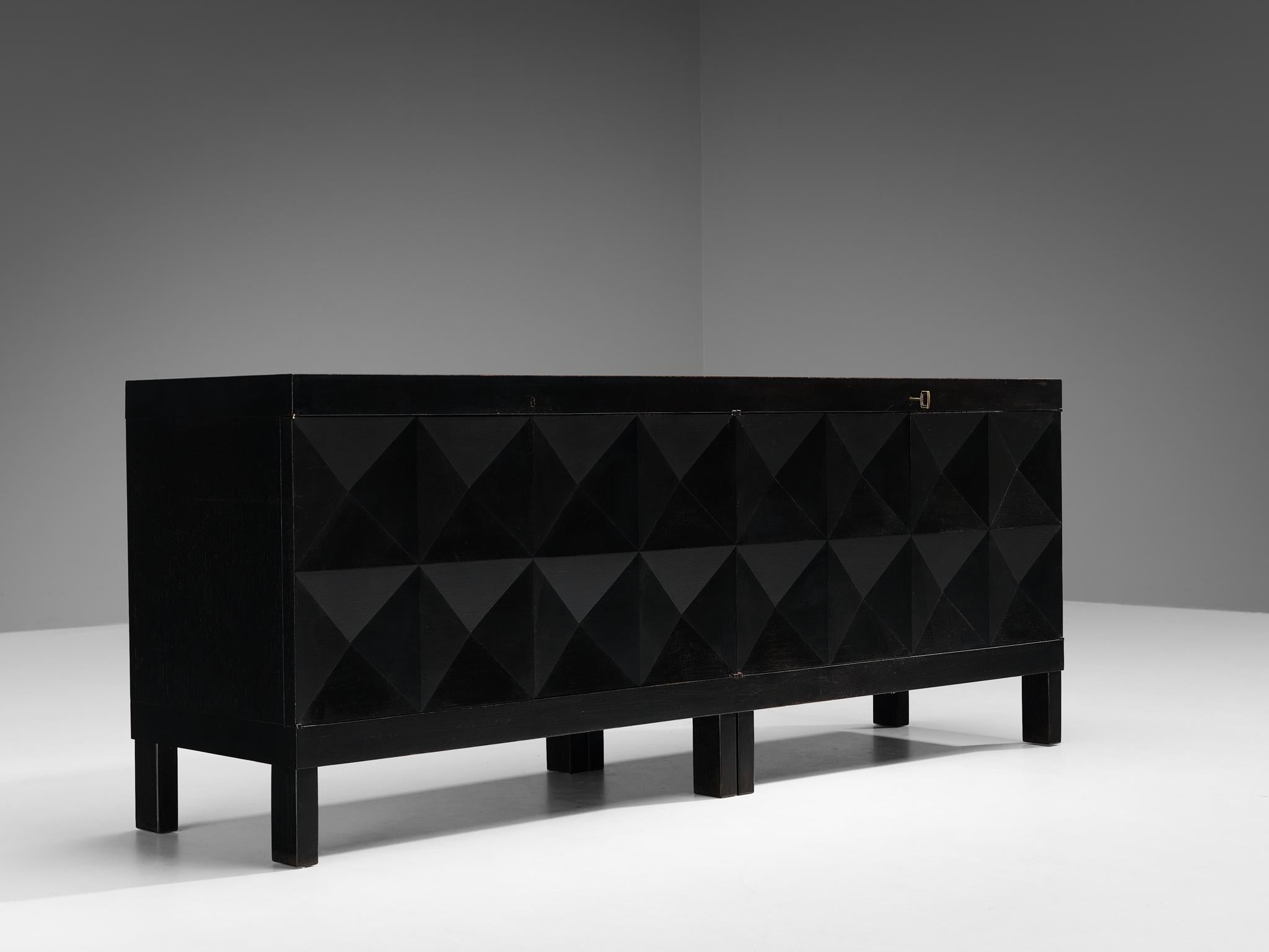 Sideboard, lacquered oak, brass, Belgium, 1970s. 

This credenza was made in Belgium in the 1970s. It features a clear rhythm and flow established by means of a well-thought-out lay out that is utterly well-balanced. The carved geometric lines on