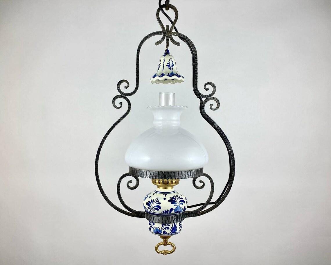 Vintage metal chandelier with opaline glass and clear glass plafond. Released in Belgium, in 1950s'.

Extraordinarily beautiful chandelier, which is decorated with high-quality casting - ornate decor.

This is a real - masterpiece - sculptural