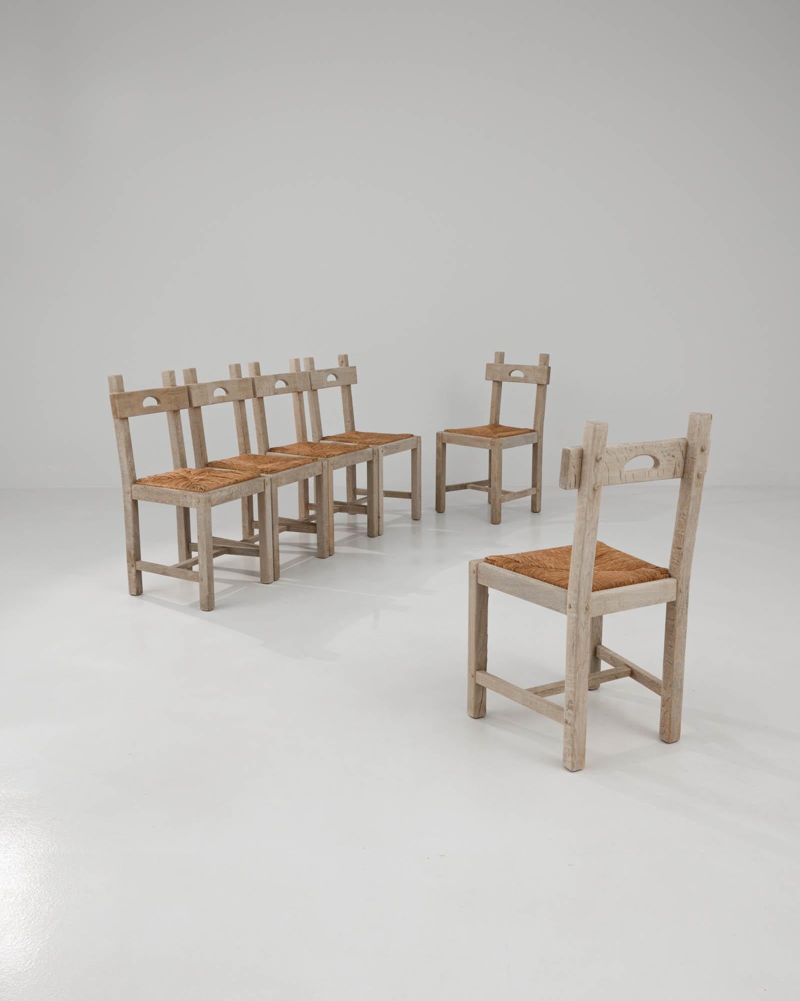 Homespun and charming. With woven seats and a pegged joint technique, this set of six oak dining chairs was crafted in a country style. Have a seat and take part in a laid-back occasion along with your guests. Bring your social gatherings images of