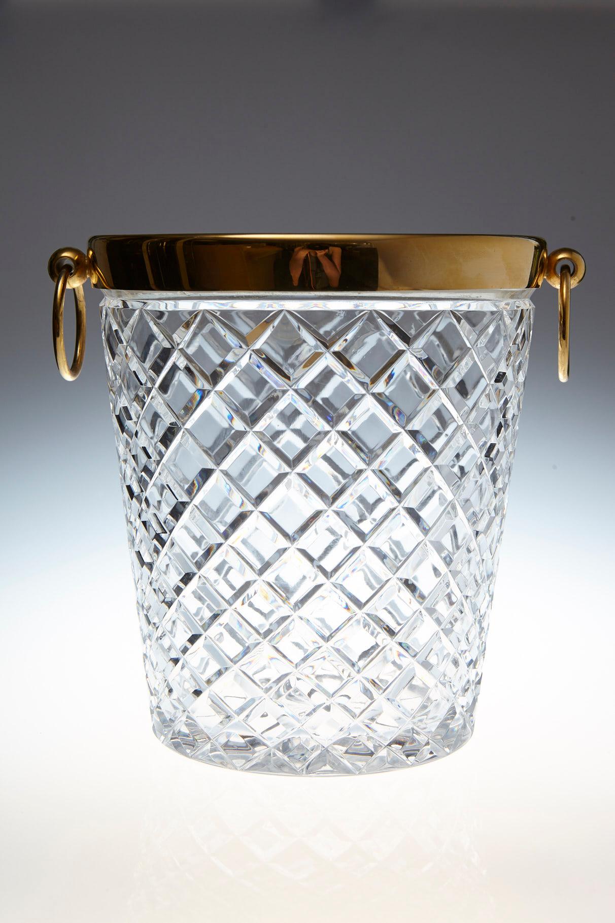 Impressive Belgian crystal and brass-plated ice bucket with diamond cuts and drop ring pulls.
The ice bucket was purchased at the then famous Saks Fifth Avenue 'Guest and Gift Shop' and has it's original sticker.
The ice bucket and specially the