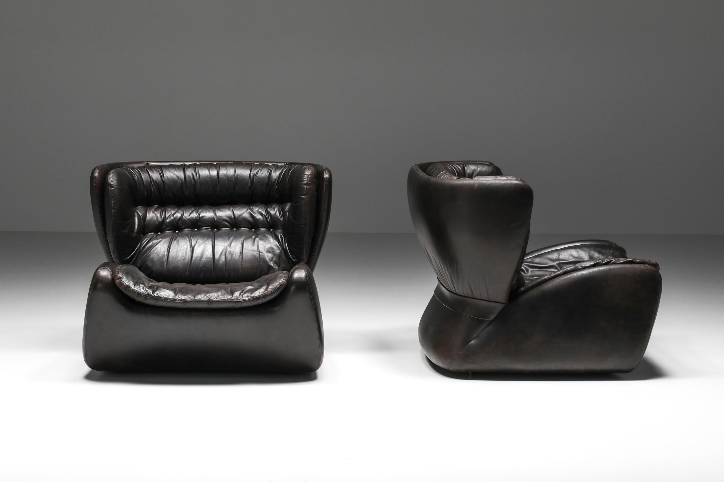 Belgian furniture design; 1970's, Lounge chairs; Ottoman; Leather; Luxury 

Heinz Waldmann & Anita Schmidt for Durlet in 1970, dark chocolate brown leather, two lounge chairs, and one ottoman. Durlet is a luxury leather furniture brand from