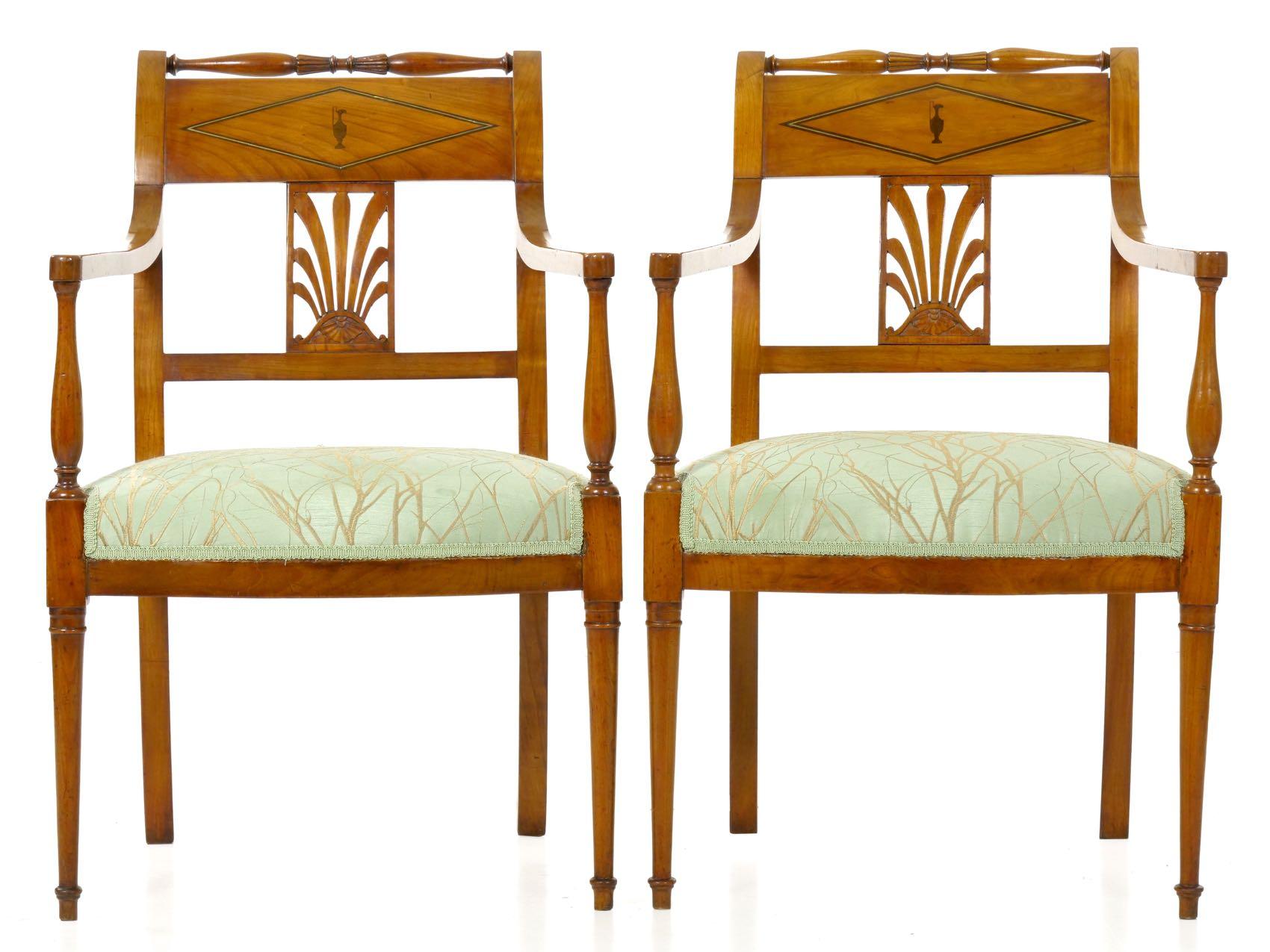 An exquisite and finely crafted chair set en suite consisting of two arm chairs and two side chairs, they are delicate in profile and precise in workmanship. The crisp central stamp to the reverse of the seat rail reads CHAPUIS, the marking of