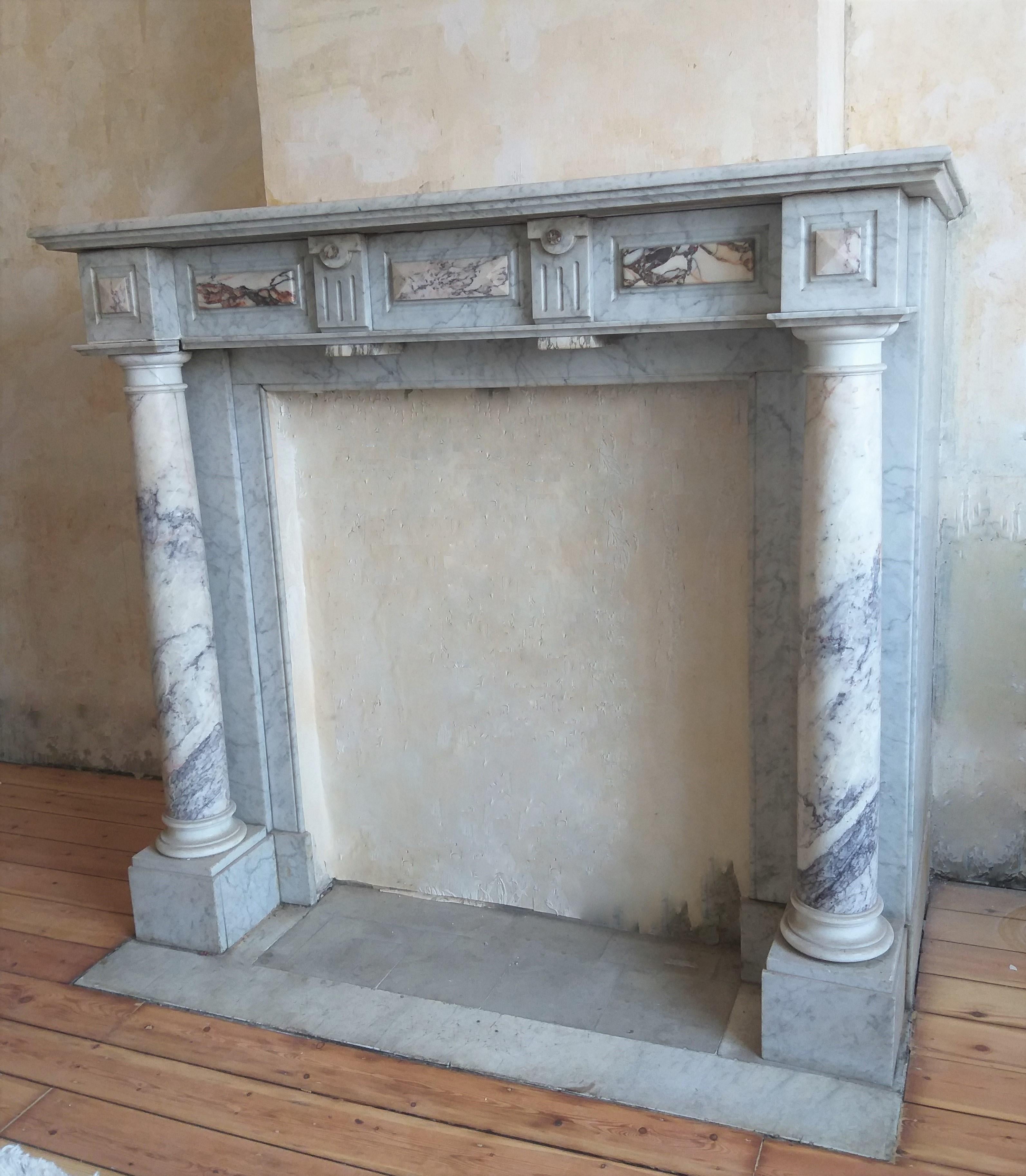 A classy Belgian fireplace surround from the late 19th century. Carrara and Brècië Violet marble.  The photo's showing a bit bleu in the marble, but the Carrara has NO bleu, it's like Carrara is: White-nuance with some soft grey veins.  The bleu was