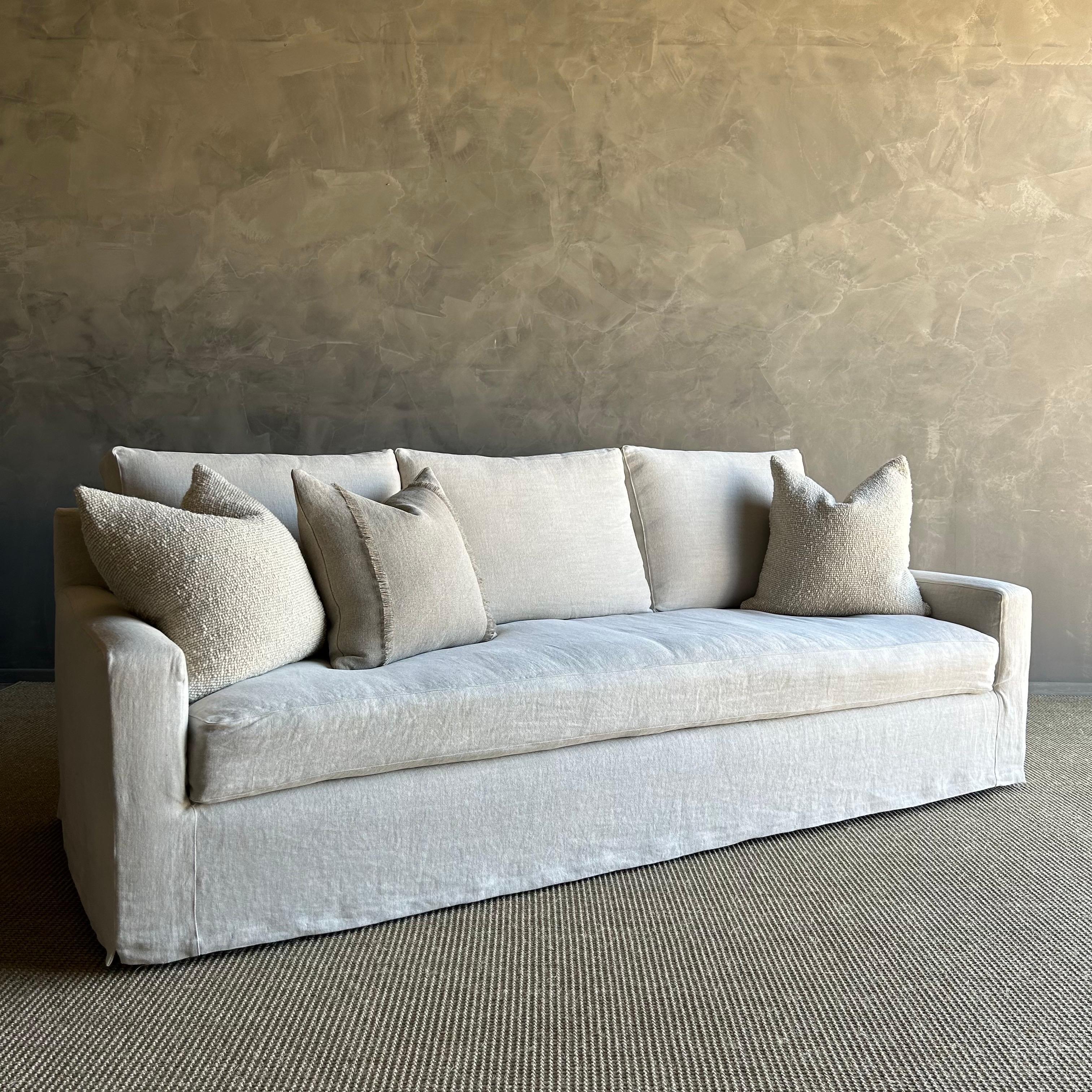FLOOR MODEL / LIKE NEW
Bench-made by master craftsmen in Los Angeles CA. Kiln-dried, precision-cut, FSC-certified wood frames.  Seat cushions are wrapped in RDS-certified, responsibly sourced feathers and down, with a foam core.
Slip covered in