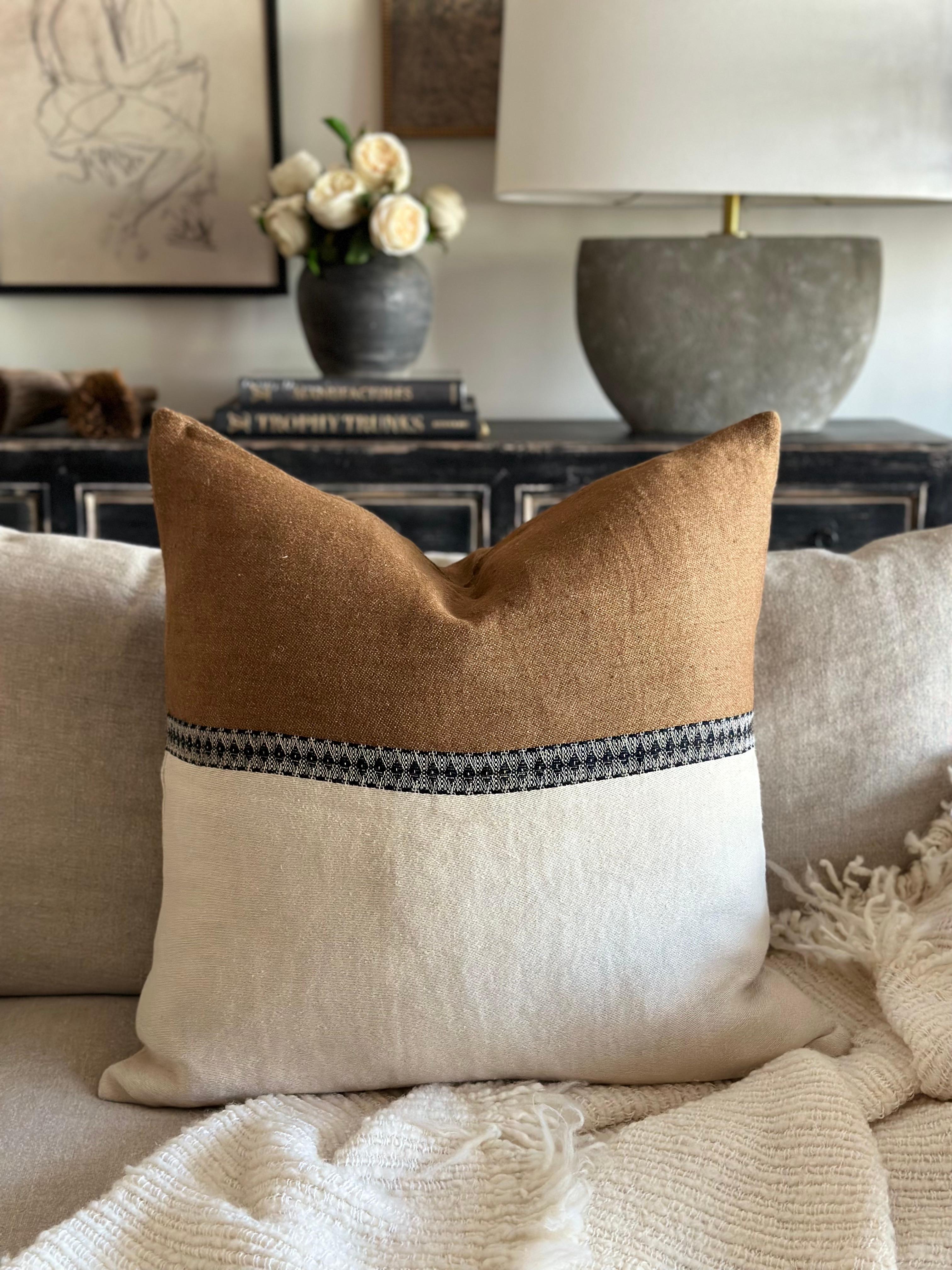 Etienne Accent Pillow 
A natural linen pillow with havane (french) brown, and black woven accent band through the center of the pillow. Washed finish, and hidden zipper closure.  Includes a down feather accent pillow.

100% LI
Size: 25