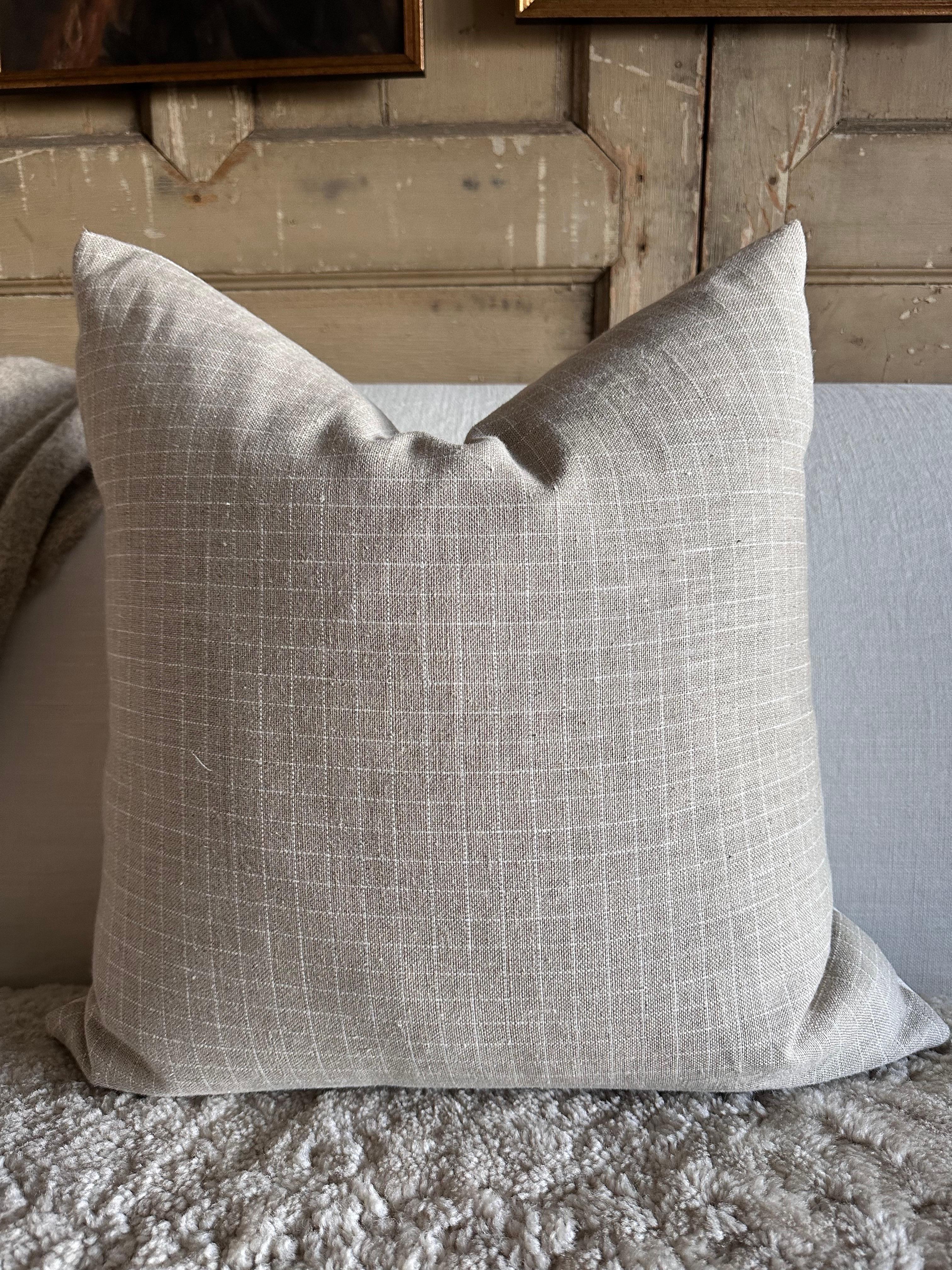 A luxurious heavy woven linen plaid face with stone washed linen back.
Linen fabric is imported from France.
Custom made to order, can be customized to your size.
Color: Blanc / Oyster / Natural
Antique brass zipper
Size 20x20
Includes Down Feather