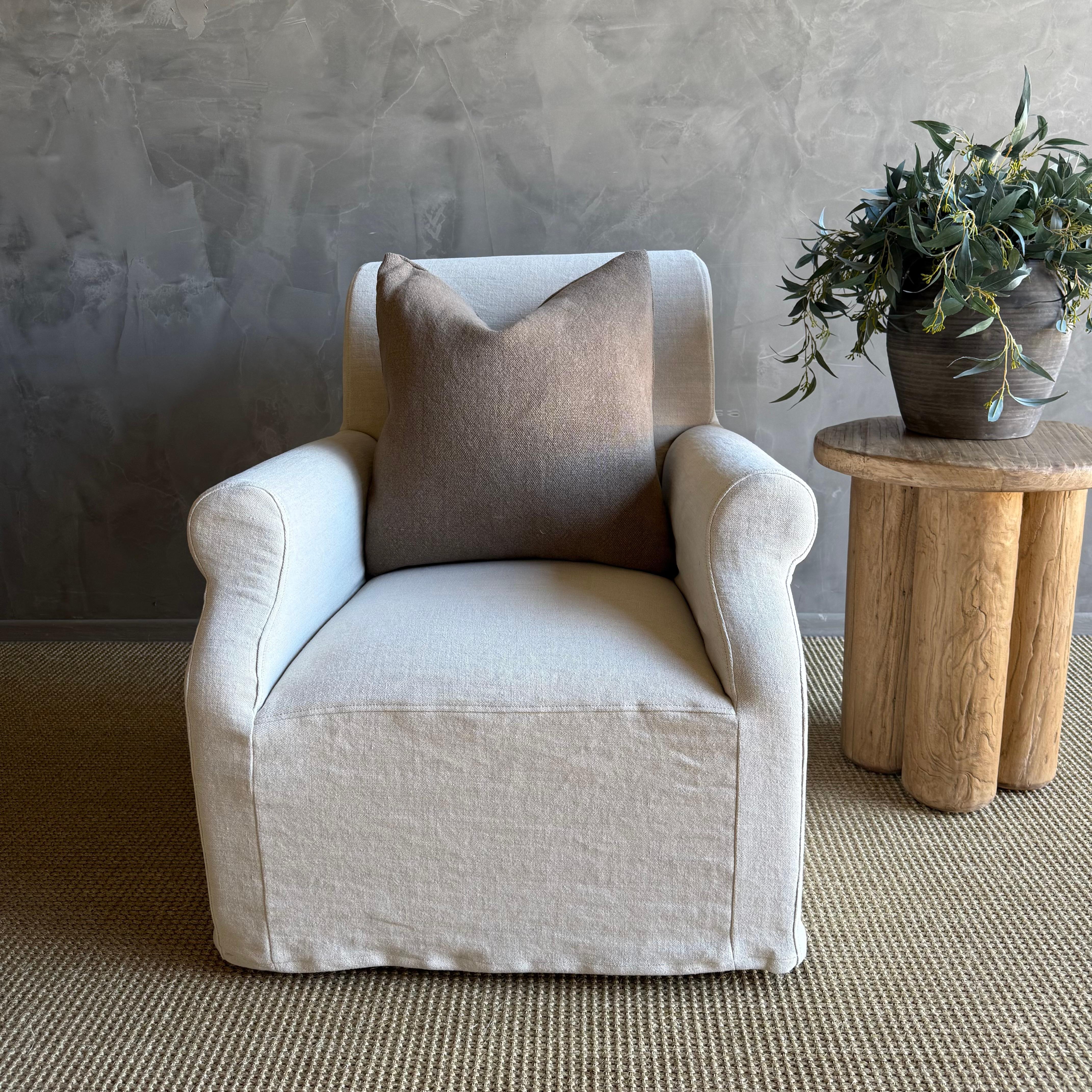 Introducing the Ans Belgian Linen Slip Covered Accent Chair, exuding classic European style with its elegant design. Crafted with luxurious Belgian linen, this accent chair features a removable slip cover for easy cleaning, ensuring lasting beauty