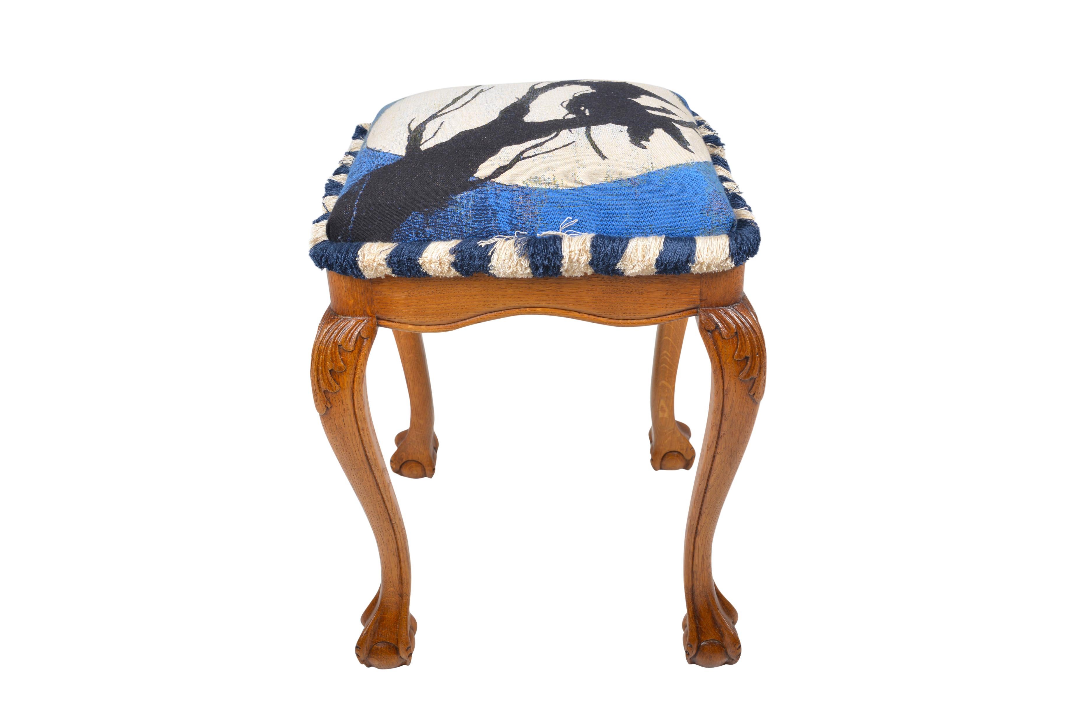 Belgian oak stool in the Louis XV revival style with claw and ball feet, reupholstered in the JPDEMEYER & co style.