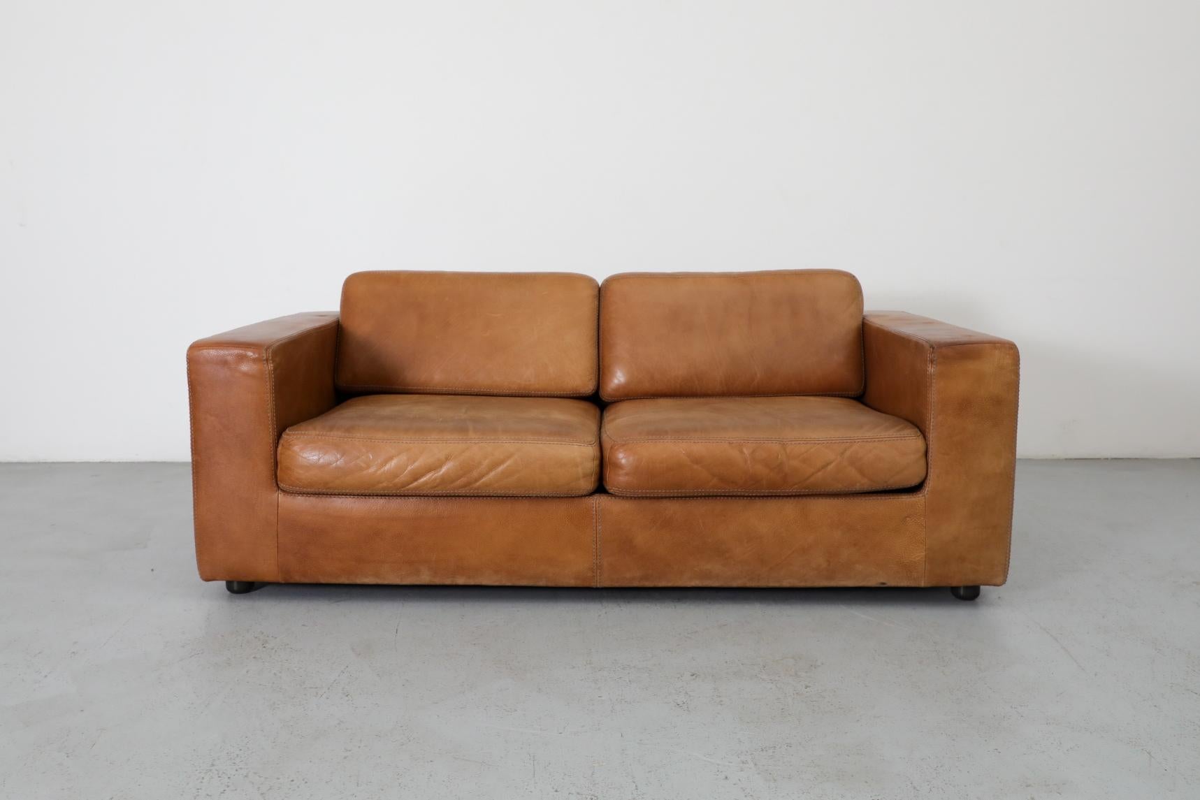 Belgian Mid-Century, cognac buffalo leather loveseat by Durlet. The Durlet company was founded in 1966 by Egide Durlet and from the start the company opted for manufacturing top quality and innovative design. Then, in 1970, the company resolutely