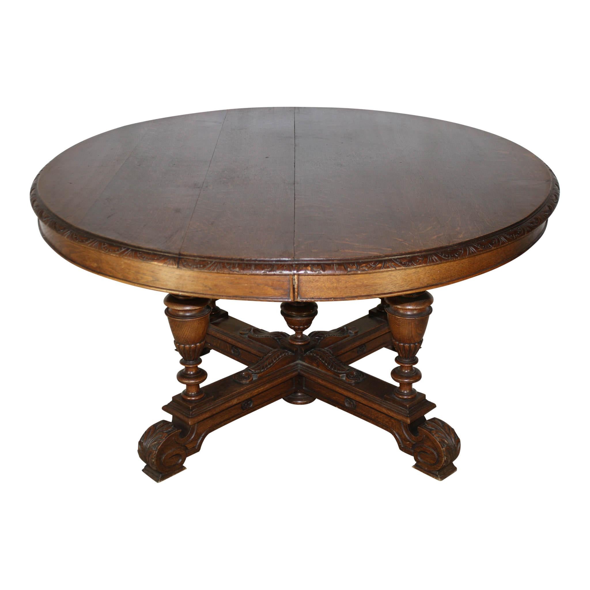 Crafted from European oak and finished with a dark stain, this oval table showcases beautiful grain patterns in the solid quarter sawn oak top. Raised on four turned legs that are united by an X-stretcher base, the table has a height of 28 inches.