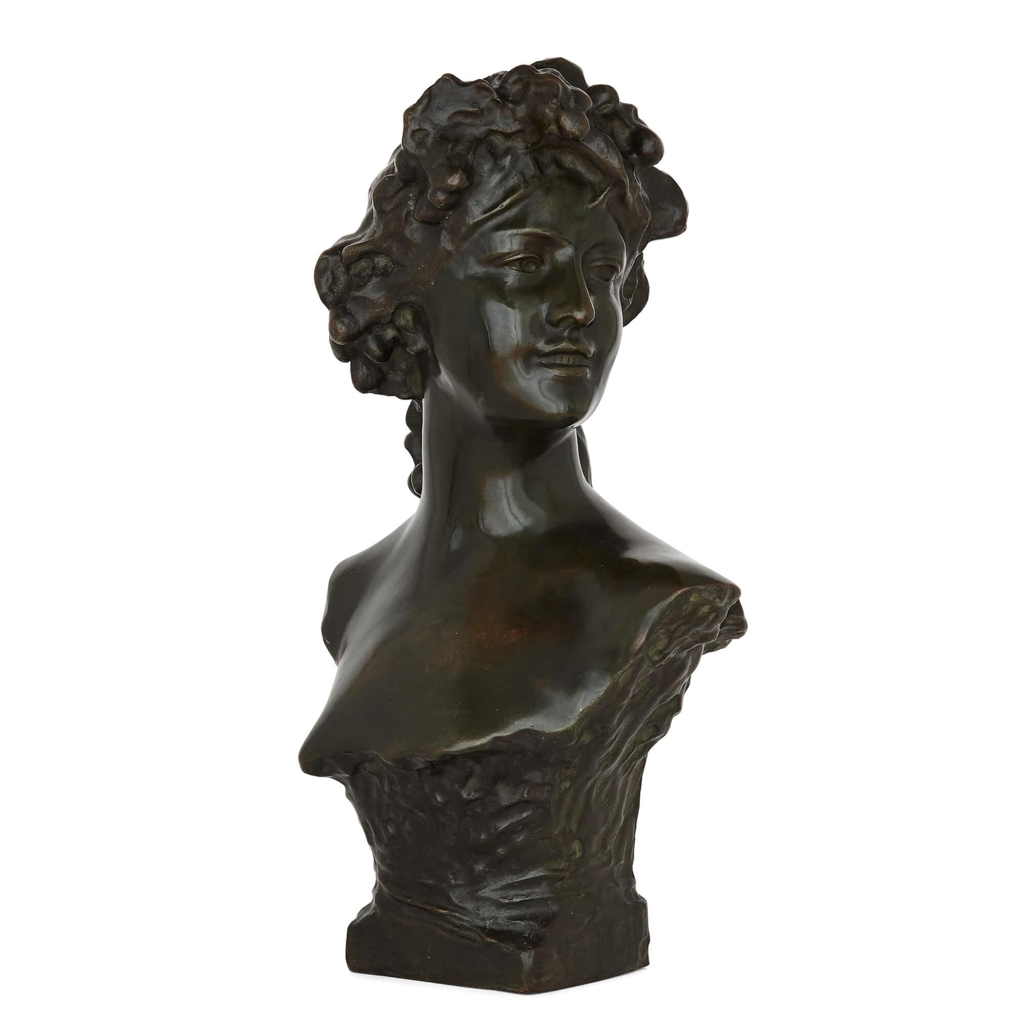 Belgian patinated bronze bust by Lambeaux
Belgian, late 19th Century
Measures: Height 63cm, width 35cm, depth 15cm

This charming patinated bronze bust by the Belgian sculptor Lambreaux depicts a young woman. The sitter, her head turned to her