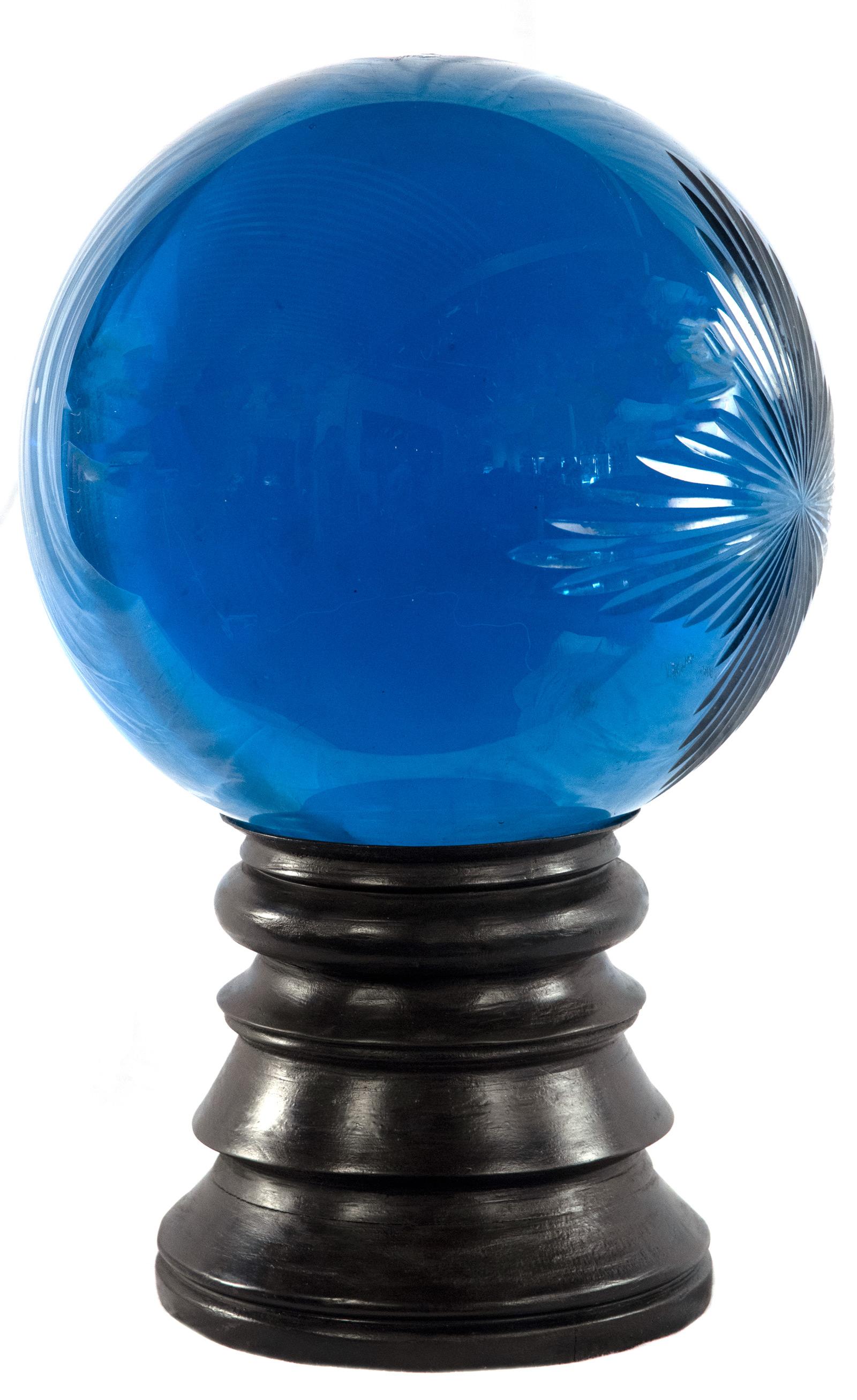 Traditionally placed in the shop windows of herbalists and pharmacists as far back as the Medieval times, this cut-glass globe on a turned-wood Stand would have been filled with colored water to indicate what treatments were in season or, when red,