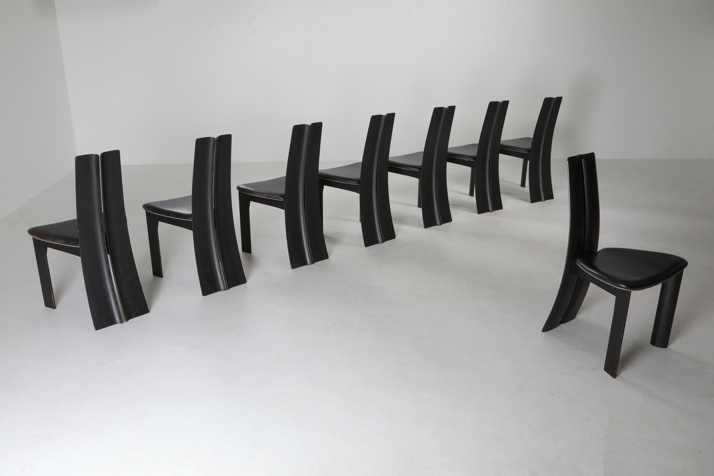 Van den Berghe-Pouvers black oak dining chairs, Belgium, 1970s

Black leather in great condition, beautiful sculpted chairs with a high arched back.