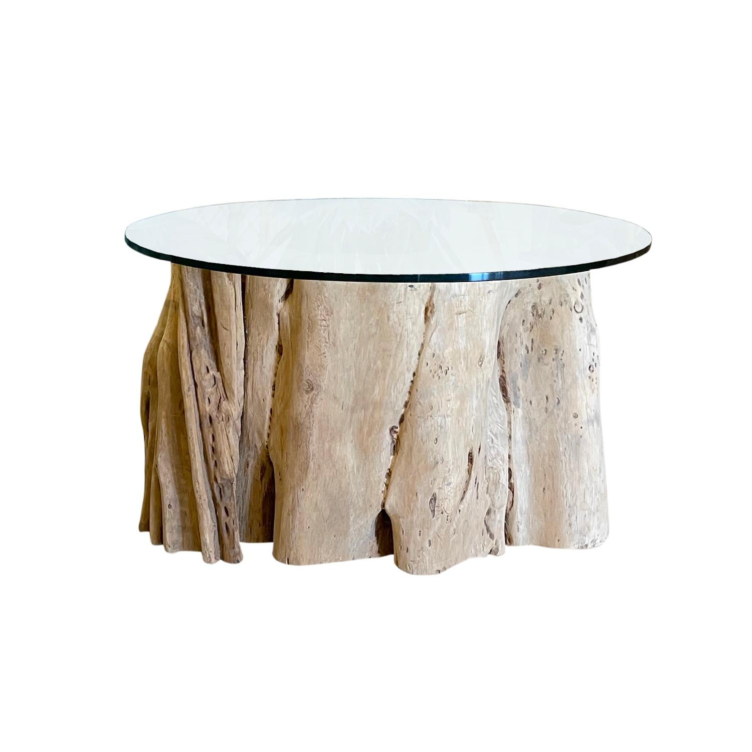 A similar Belgian set of monkey coffee tables made of hand crafted wood, in good condition. The sofa, side tables are composed with a round clear glass top. Natural root base sizes and design vary. 21st Century Belgium.