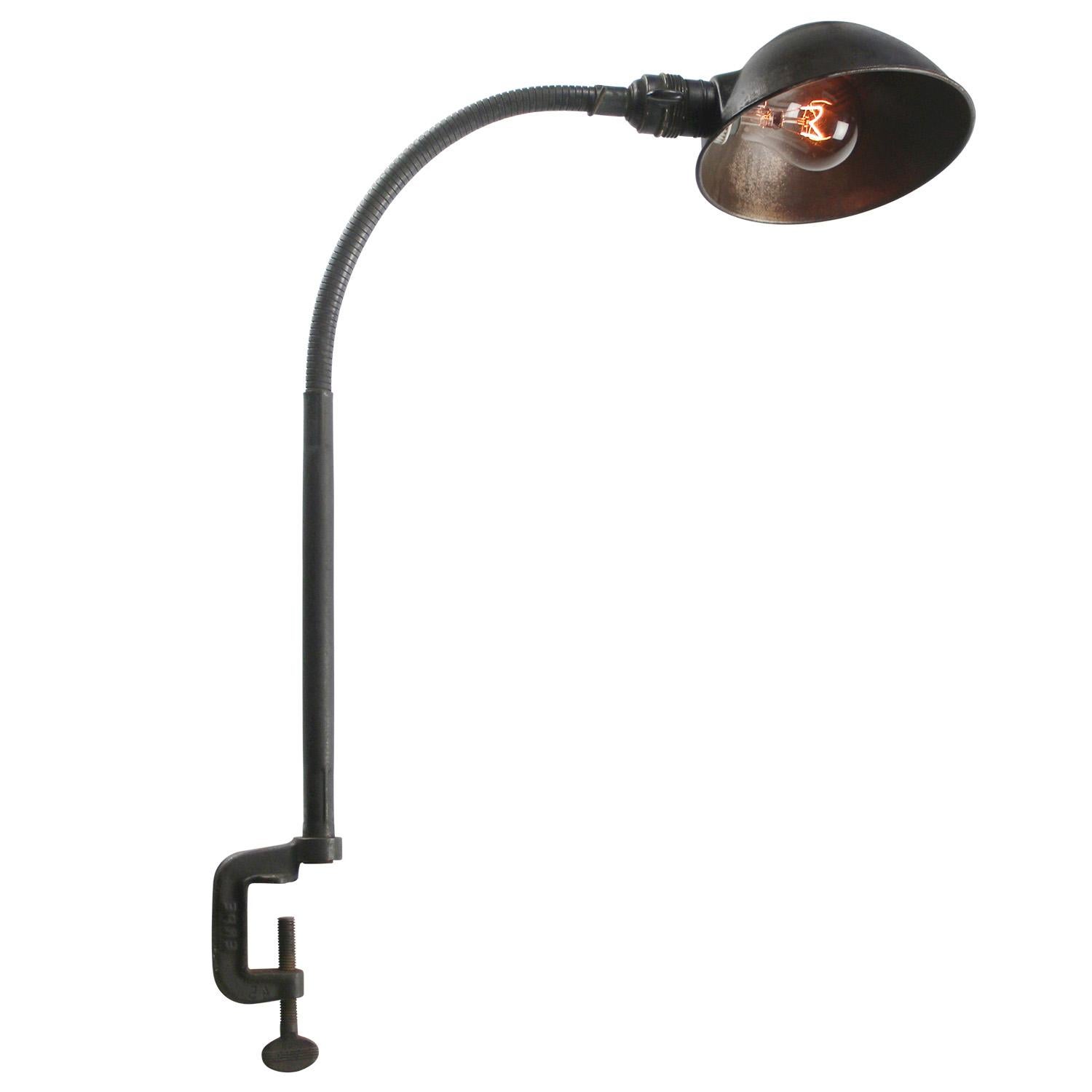 Black iron gooseneck machinist work light by Erpe, France. ca 1950
Adjustable in height and angle
Including plug and switch

Available with UK / US plug

Weight: 1.00 kg / 2.2 lb

Priced per individual item. All lamps have been made suitable by