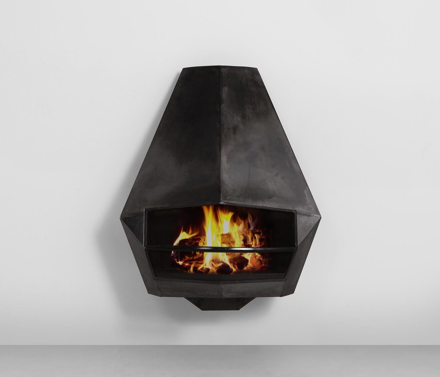 Fire place, sheet steel, Belgium, 1980s.

A well-designed fire place executed in sheet steel fits perfectly in the focal point of the room or can be placed in the middle against the wall. The whole design is based on an open construction established
