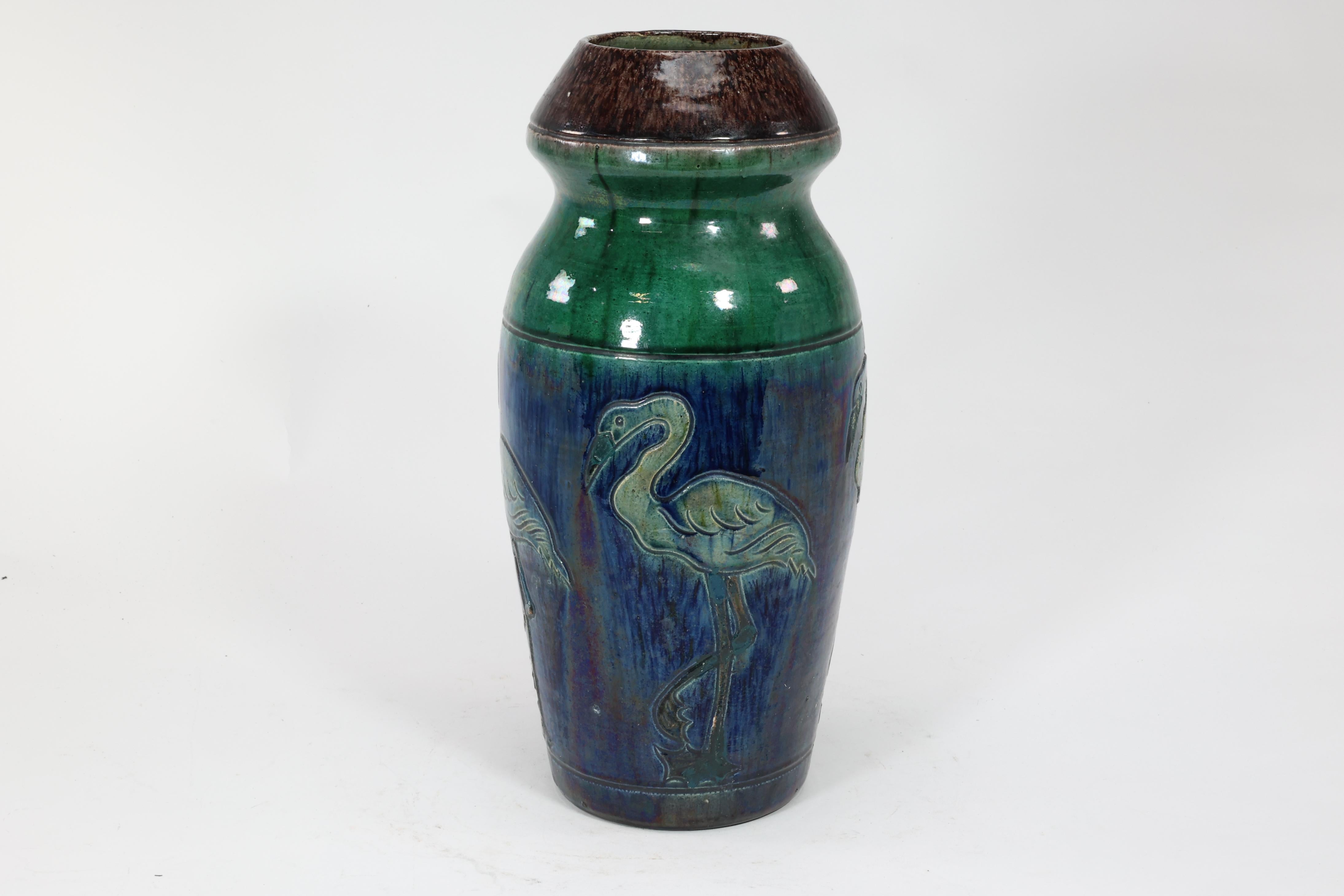 Arts and Crafts Belgium Art Pottery. Tall ceramic Arts & Crafts vase decorated with 5 Flamingos. For Sale