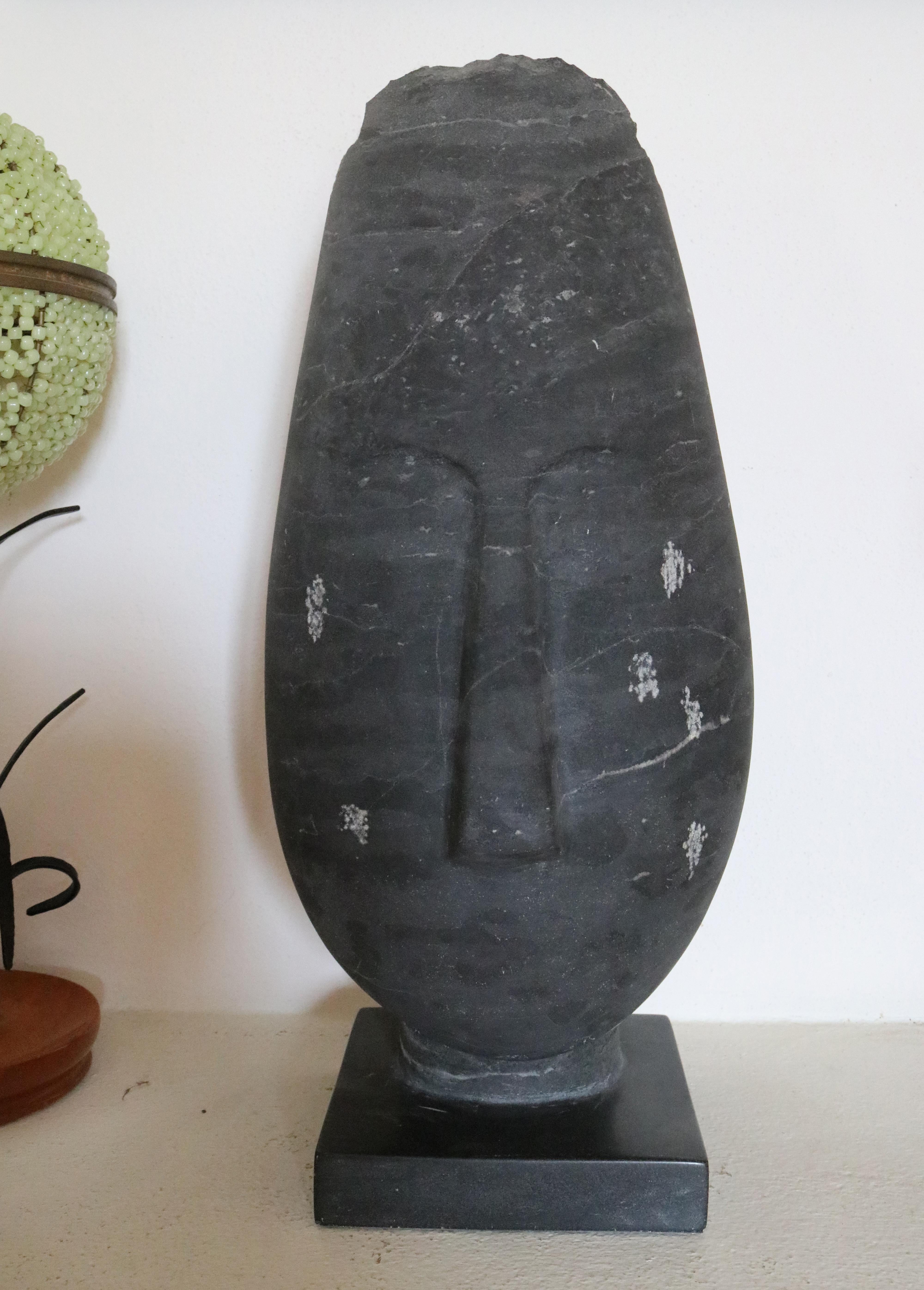 Belgium black marble hand carved modern abstract figurative elongated bust with square base.