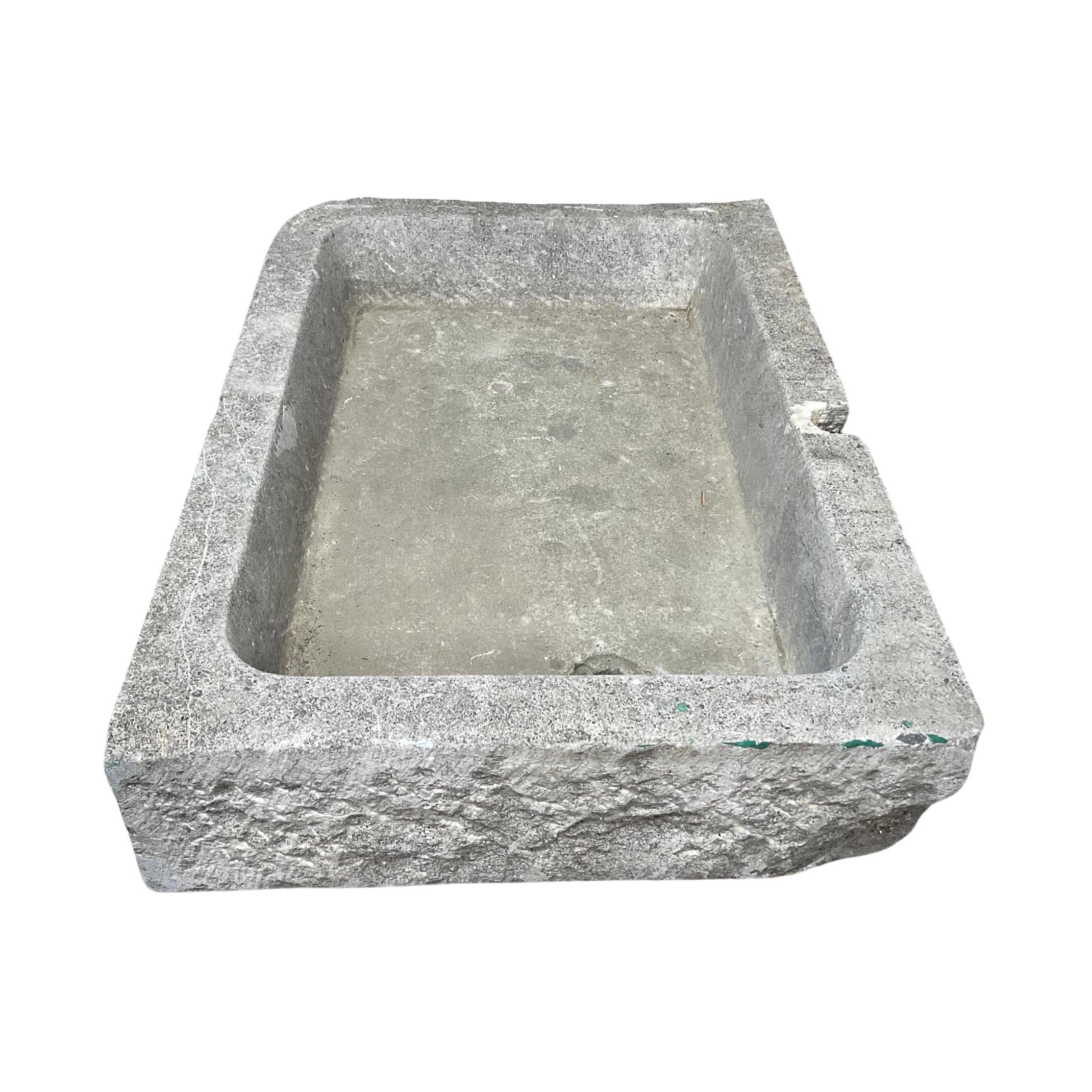 This unique Belgium Bluestone Sink is a truly one-of-a-kind item from the 18th century. It is crafted from the highest quality bluestone and boasts a predrilled drainage hole for efficient water flow. Add a piece of history to your home or office